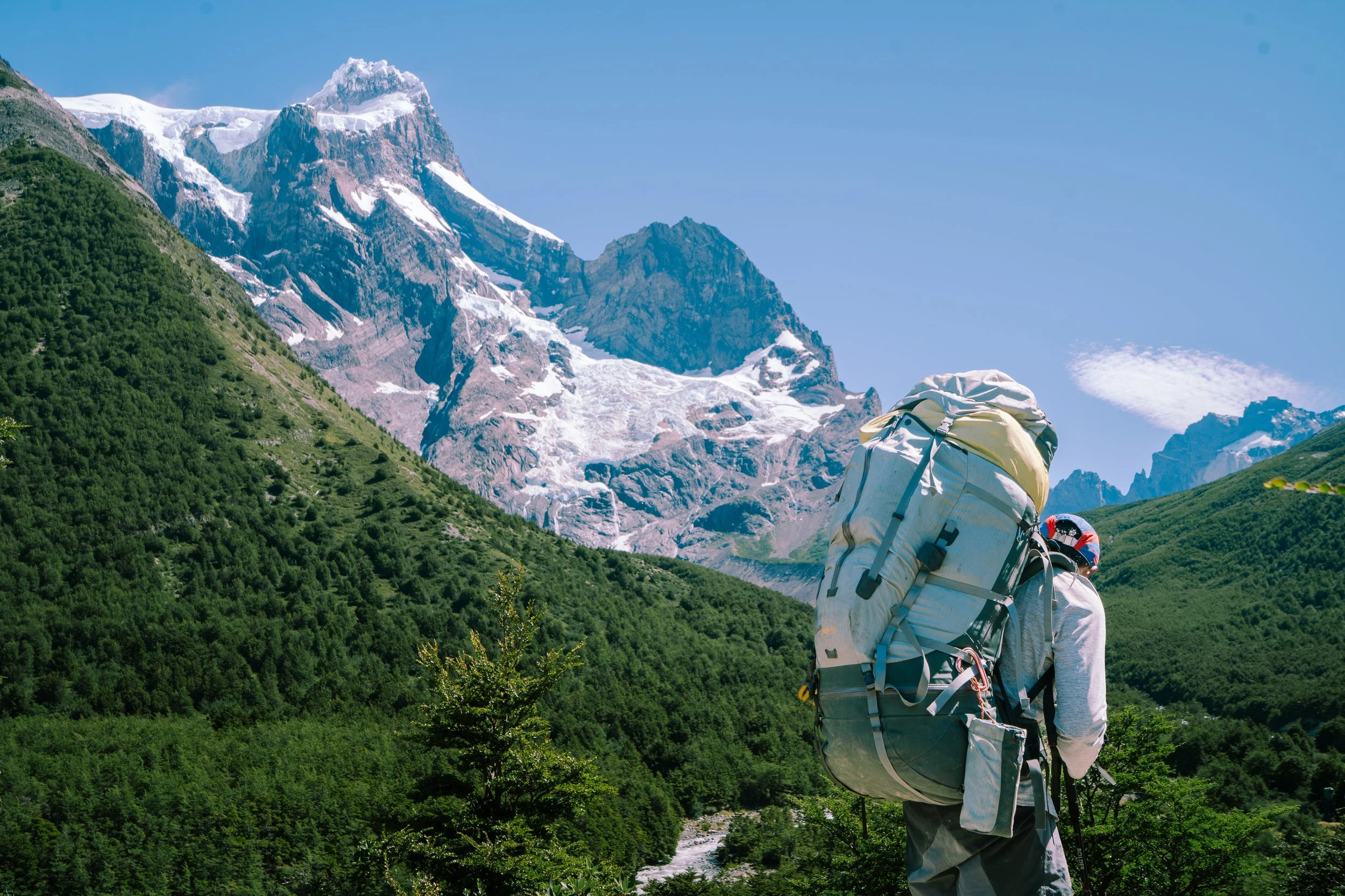 Mati portering in front of Paine Grande - spec for Arc'teryx Bora 95 Pack