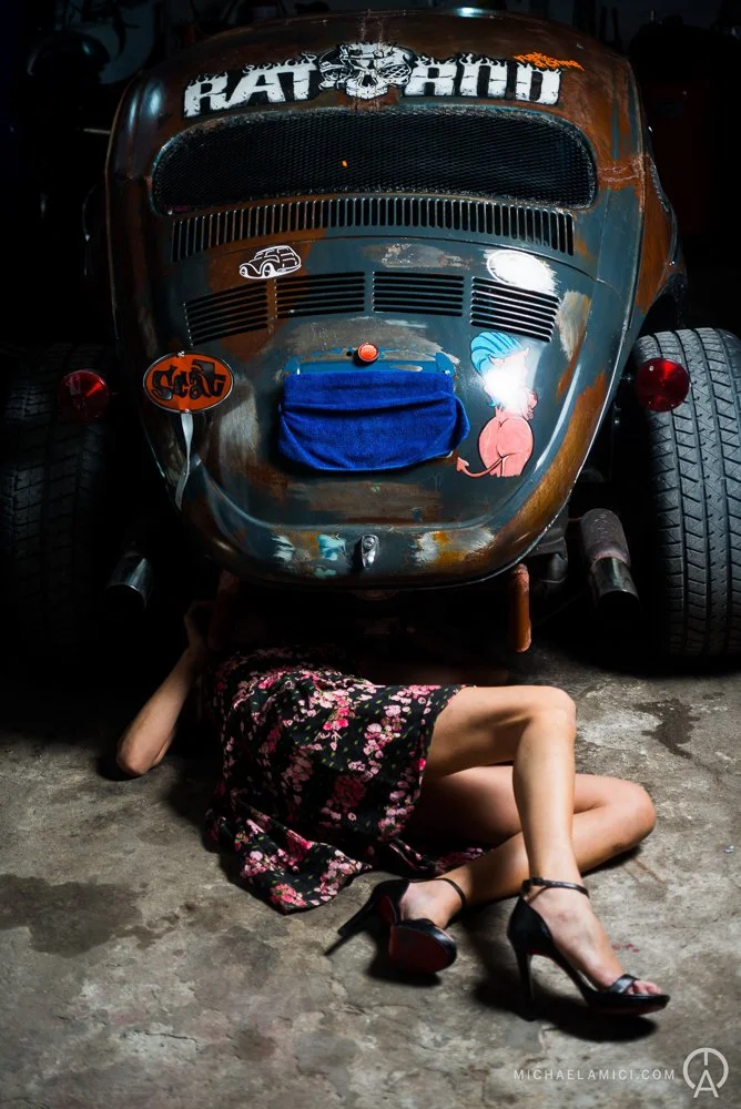 Woman under a car