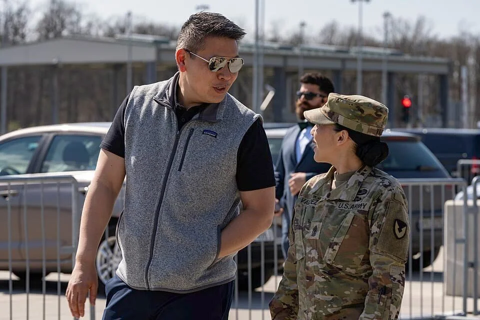 Rep. Derek Tran (CA-45) talking with army officer