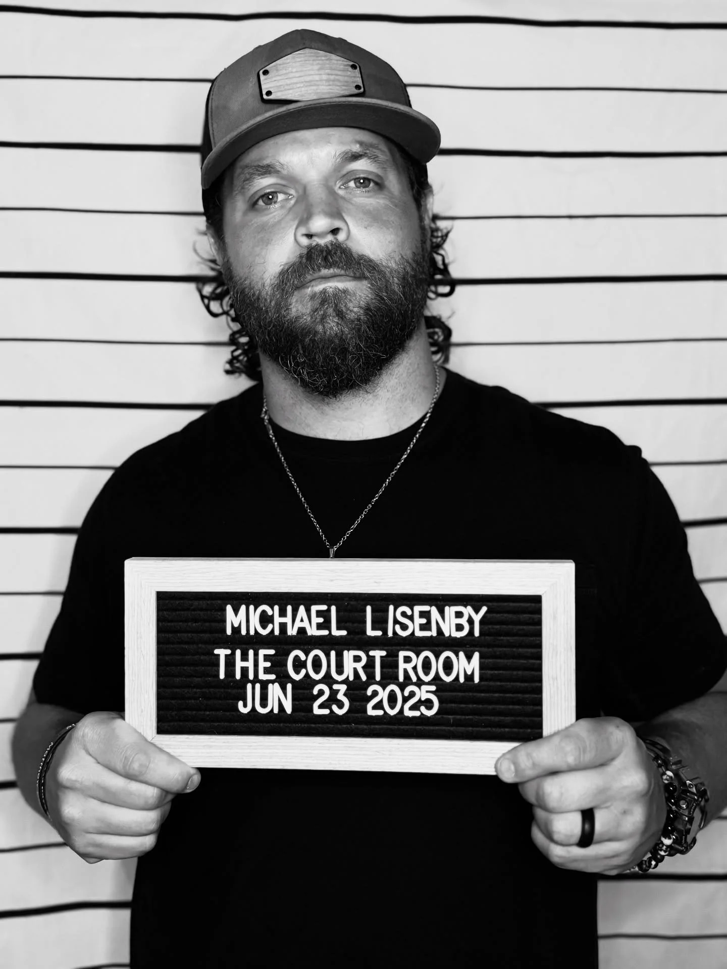 MICHAEL LISENBY

Arraignment : 06/23/2025 7PM

Michael Lisenby is a Nashville-based country singer-songwriter and former SWAT officer from Washington State. After over 15 years in law enforcement, he turned to music, writing gritty, faith-driven song
