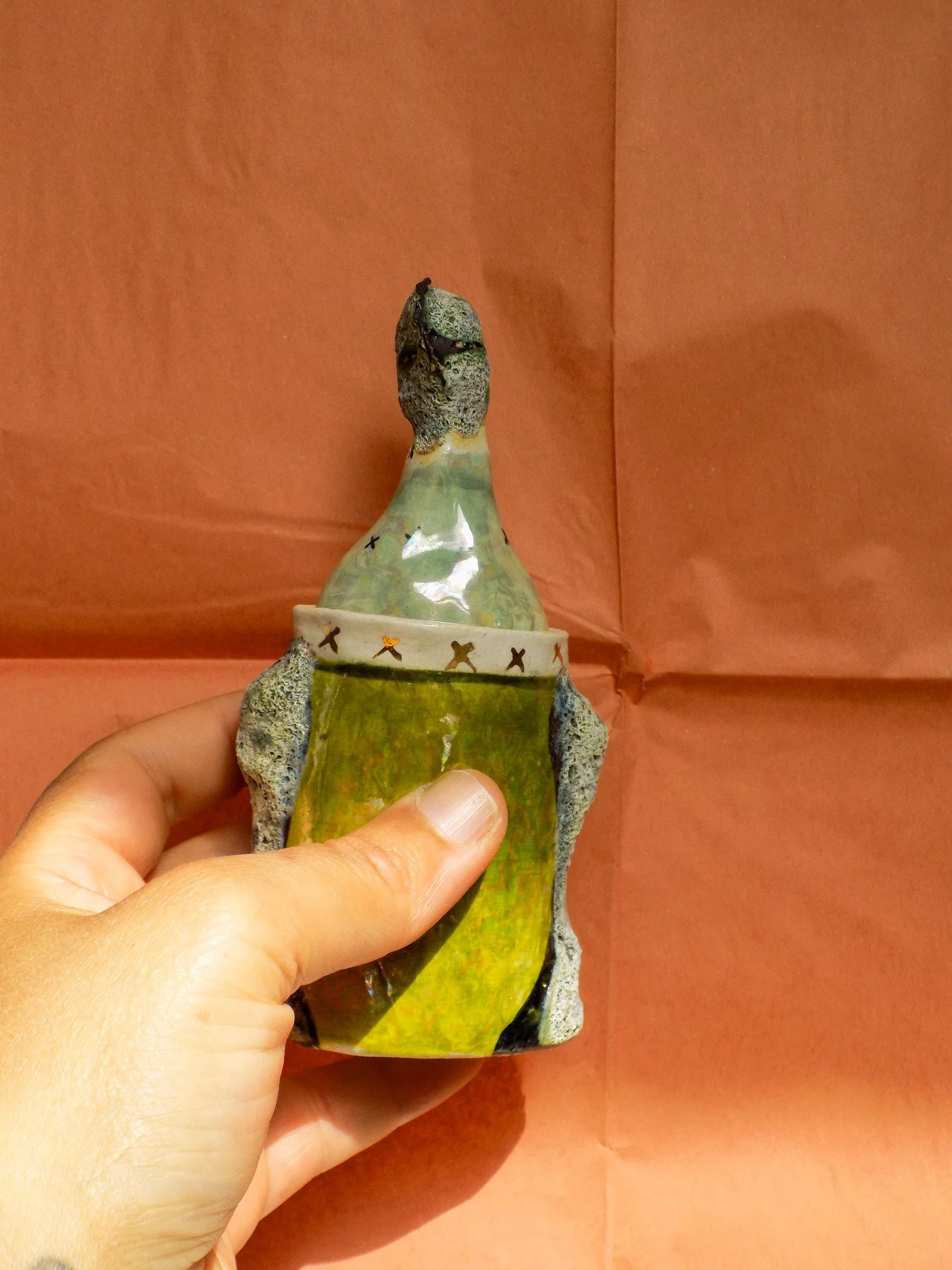 Fossil Face Figure Jar
