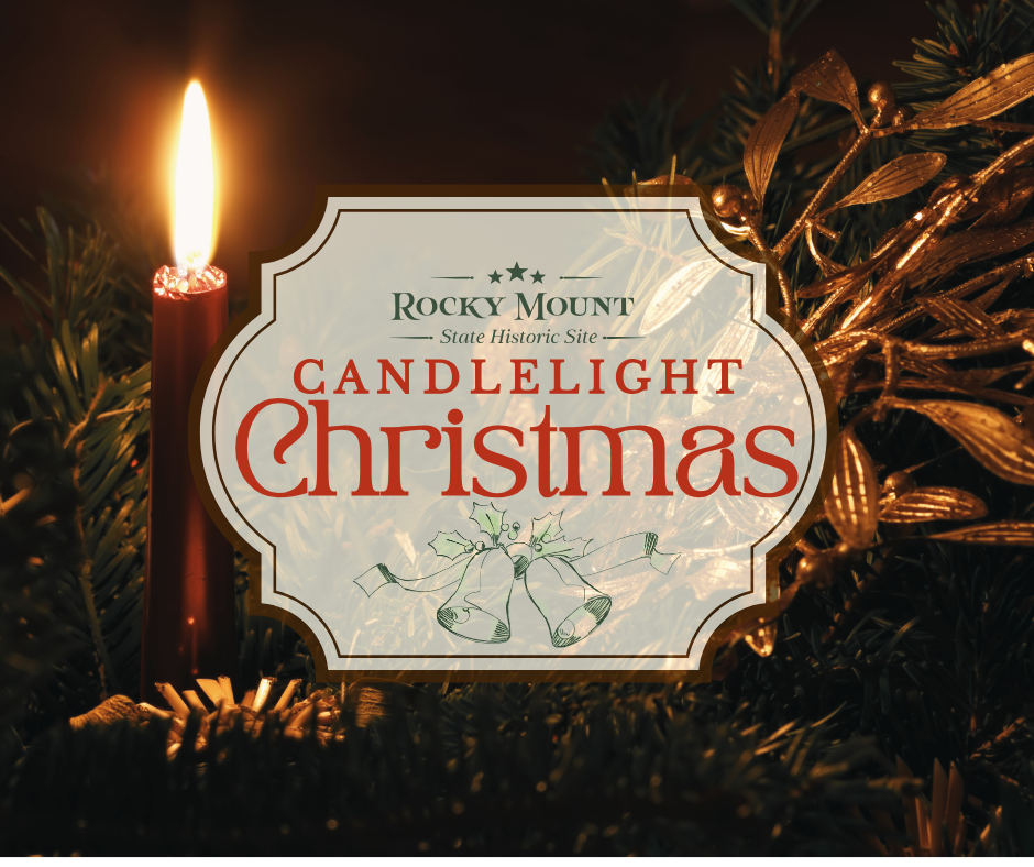 A rustic log cabin with a shingled roof is situated in a rural setting. The cabin has a stone chimney and wooden exterior. A lit candle is inside a metal lantern hanging on a hook in the foreground. The scene is set during dusk, with a cloudy sky and trees surrounding the cabin.