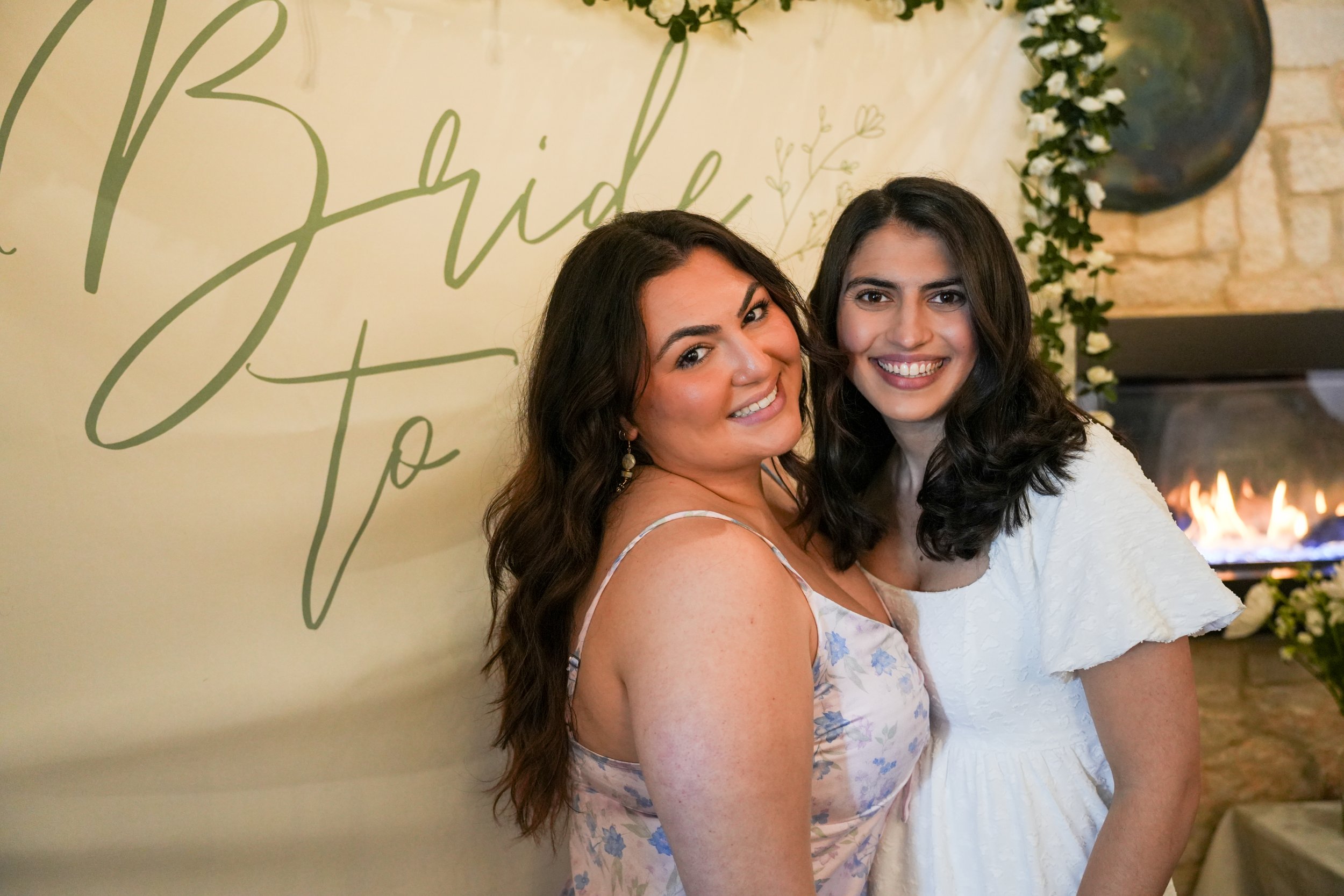 Two cousins celebrate a bride to be at a bridal shower.