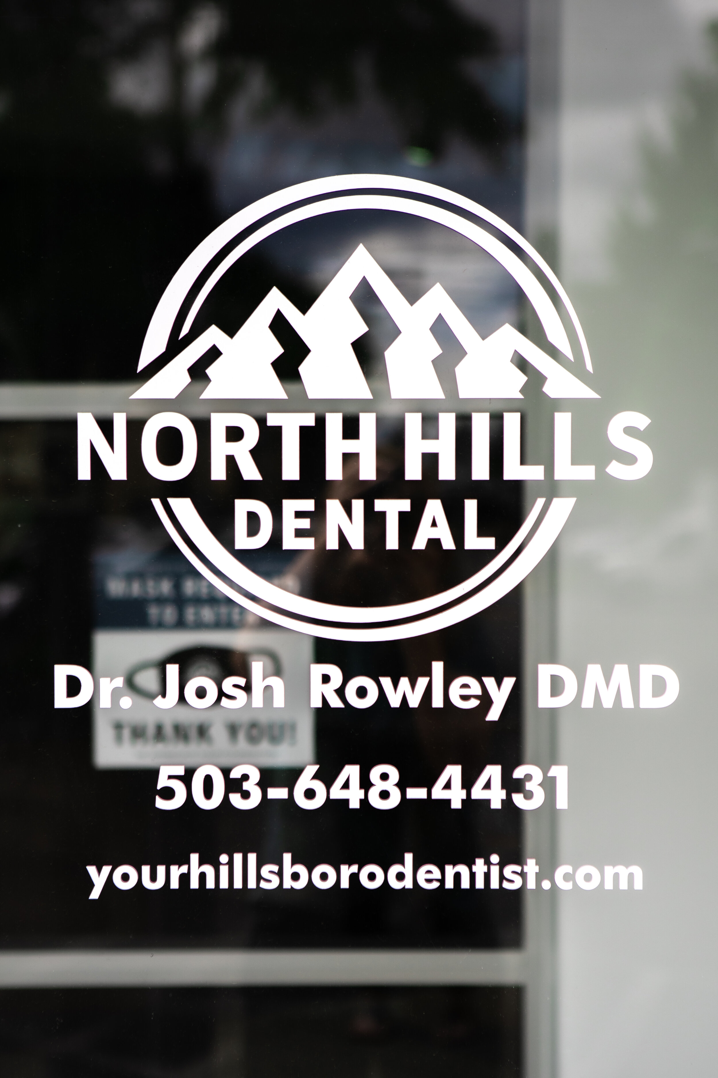 The North Hills Dental logo welcomes you to enter our front door.