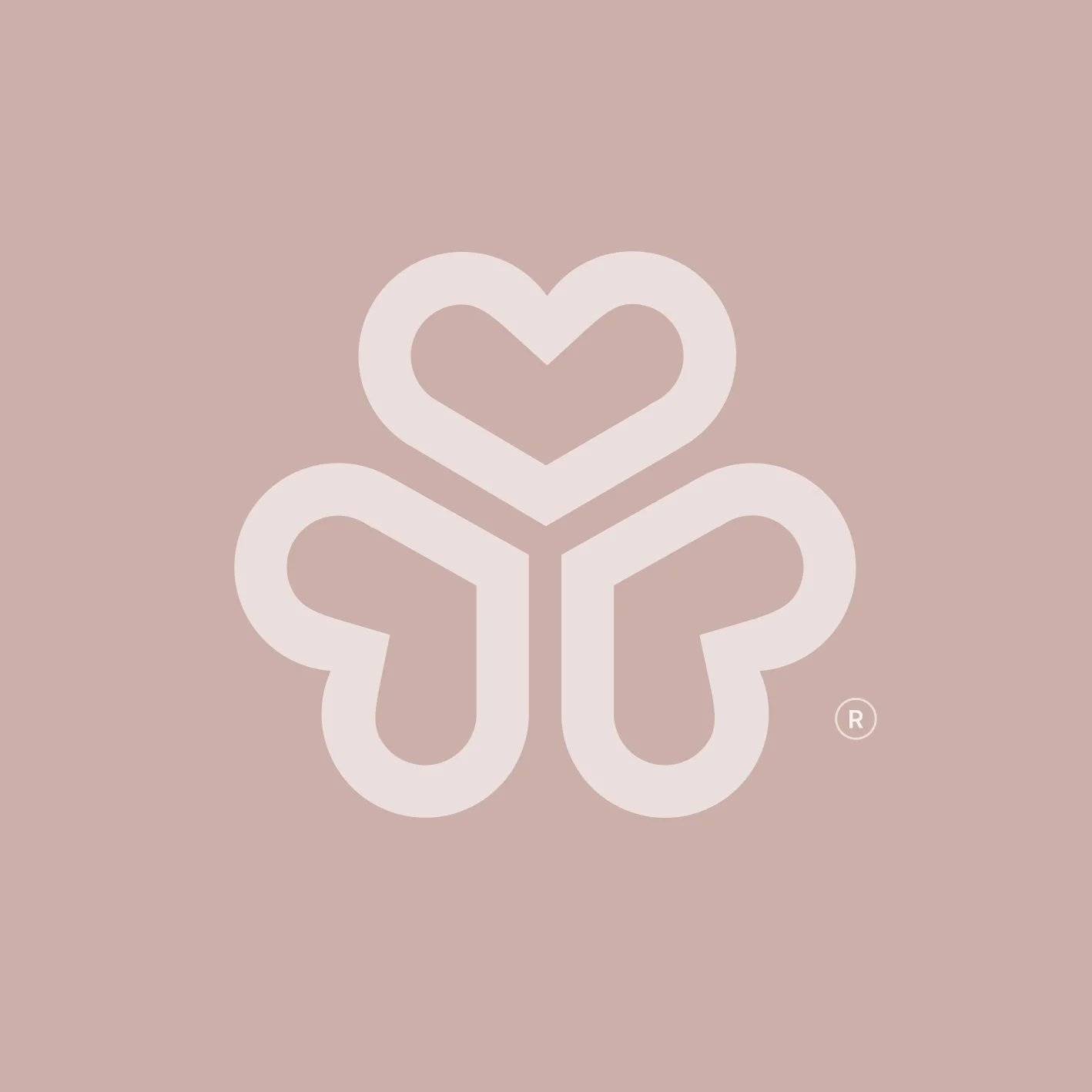 A minimalist graphic of a four-leaf clover with heart-shaped leaves on a pink background.