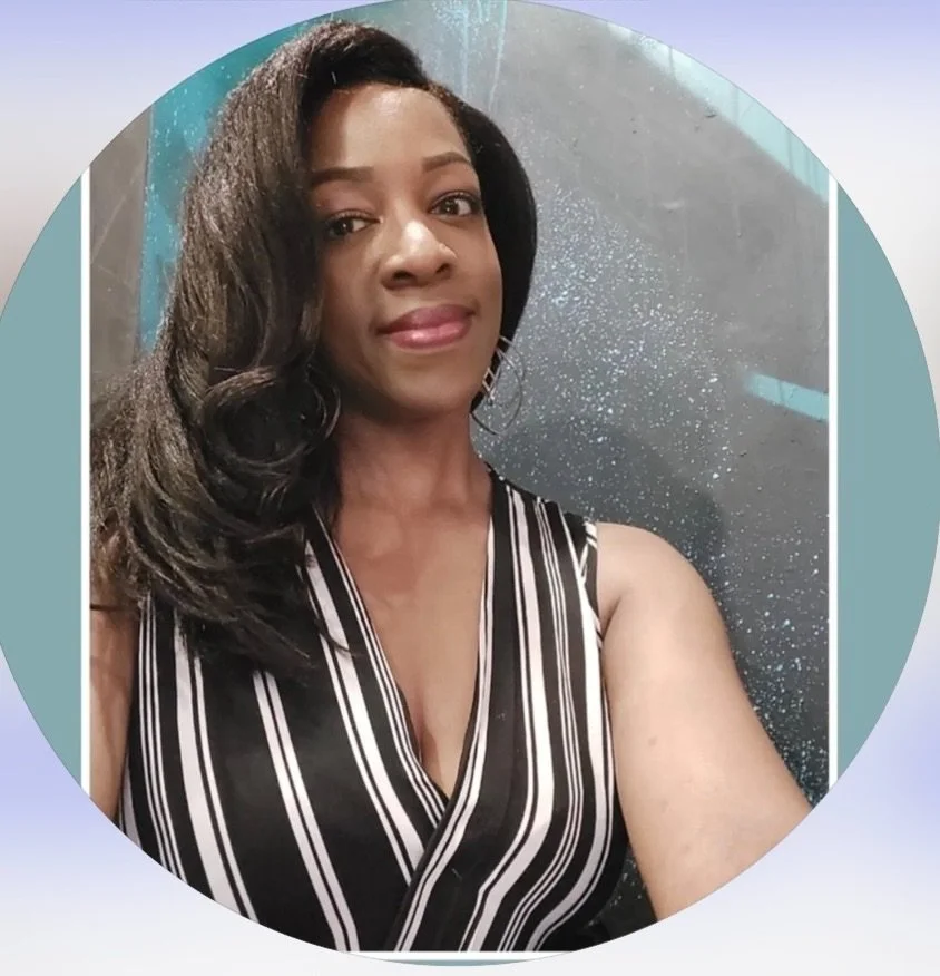 A woman with long black hair styled in loose waves, wearing a sleeveless black and white striped top, is smiling softly at the camera against a sparkly dark blue background.