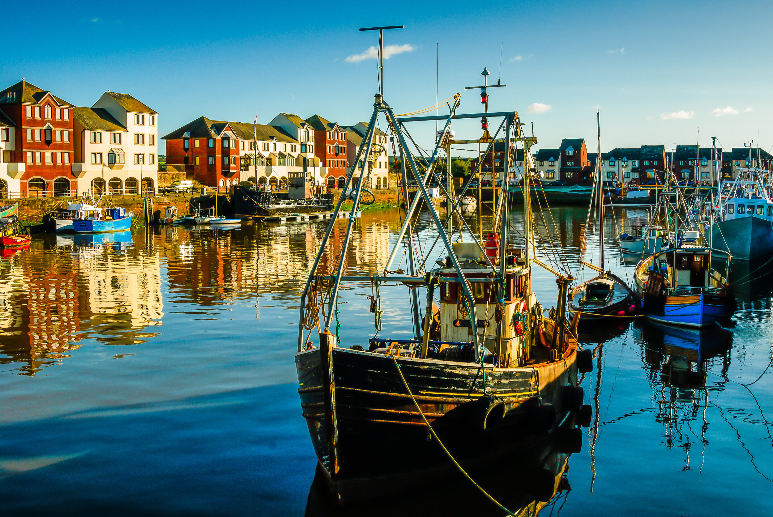 Trawlers moored in Maryport’s Elizabeth Dock, with the recently refurbished Ritson’s Wharf in the background.