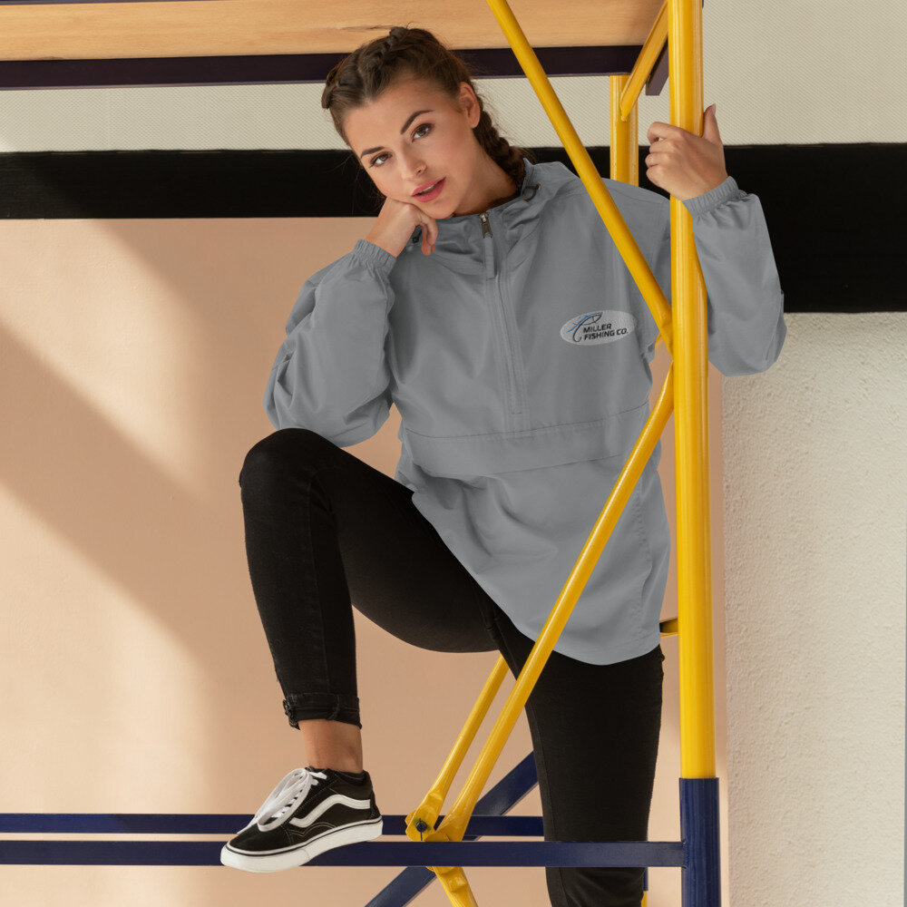 grey posing in Woman's "Miller Fishing Co " Embroidered Champion Packable Jacket