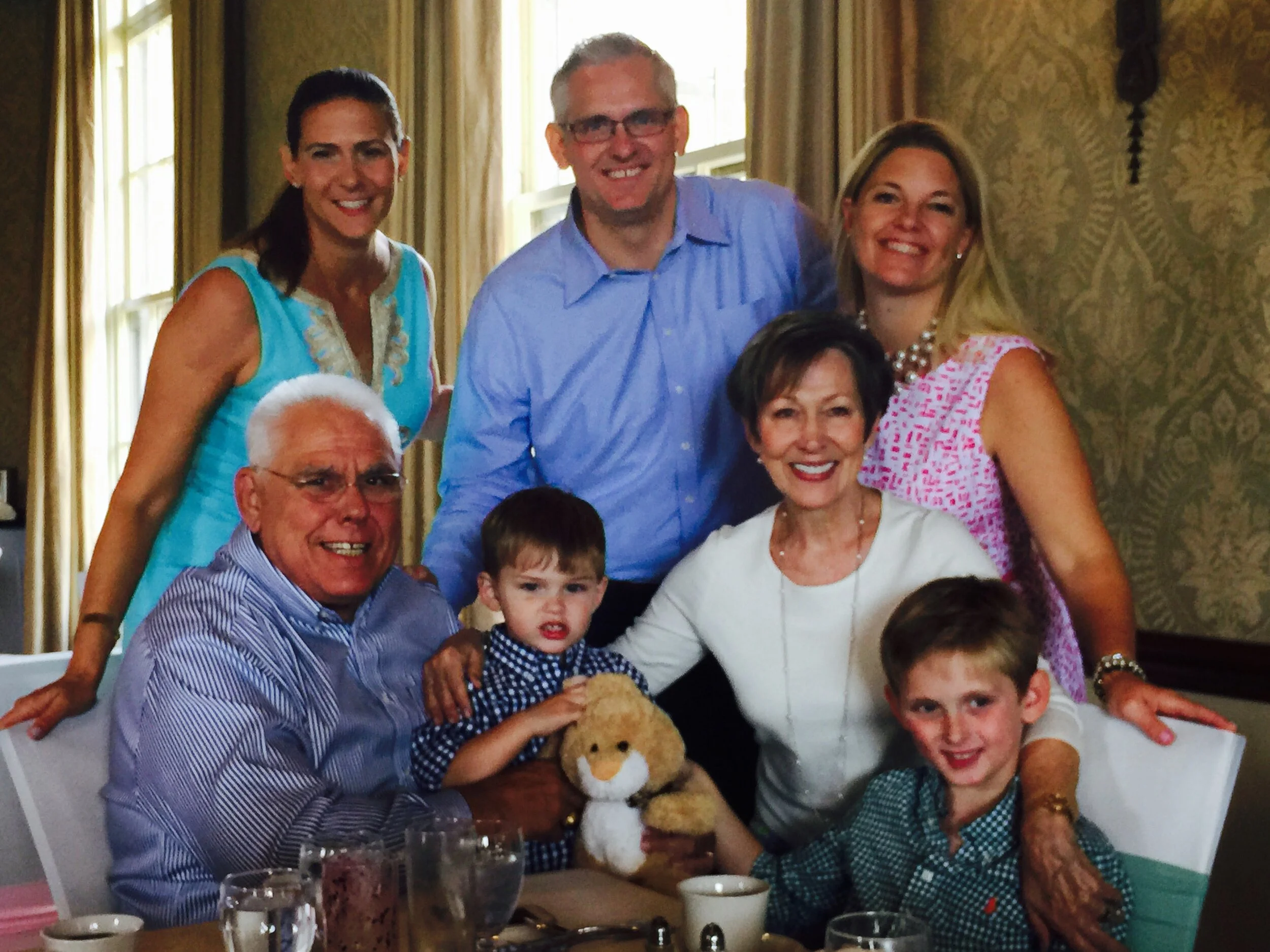 J Jon Bruno with family at a restaurant