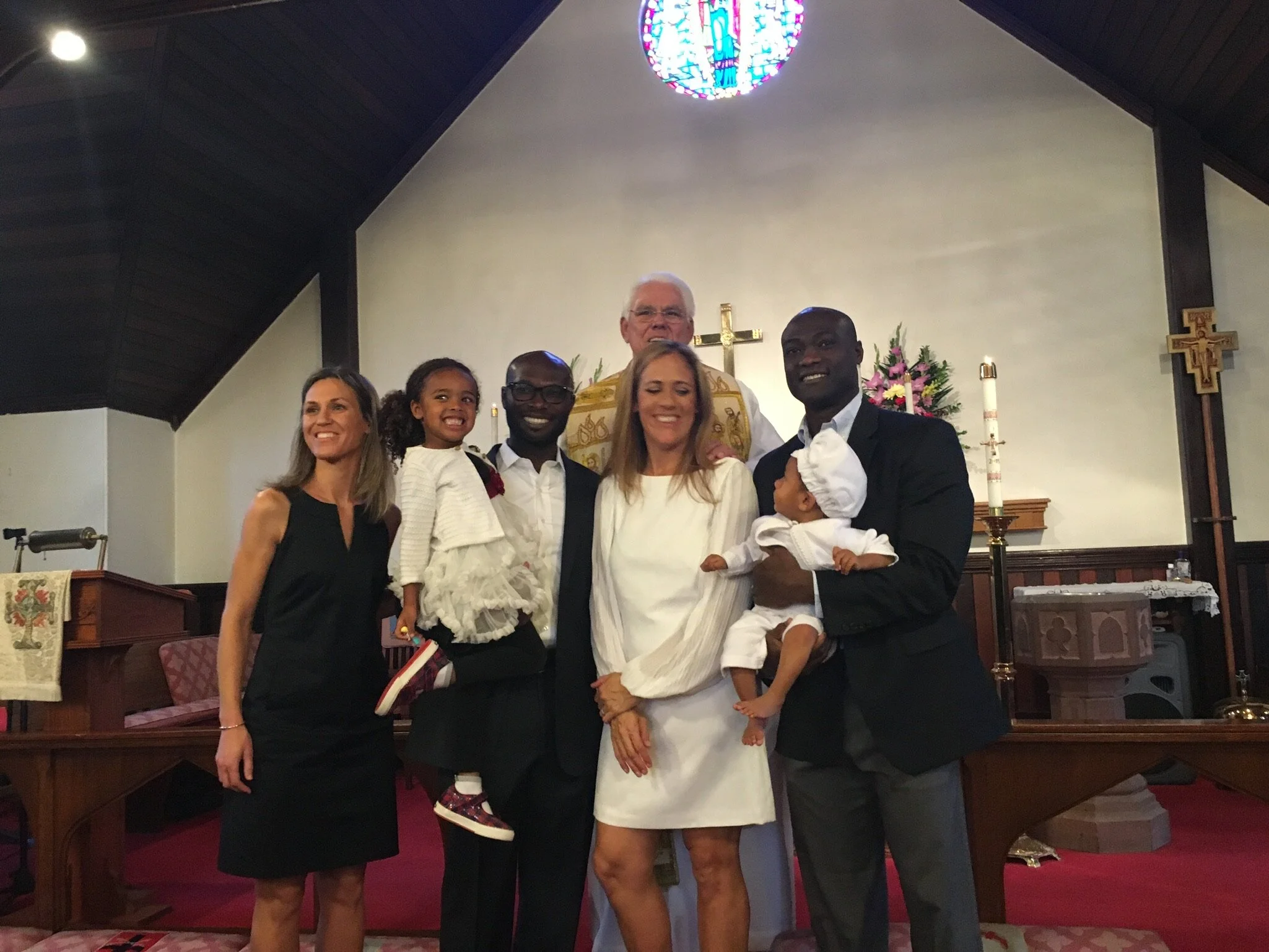 Rt. Rev. J Jon Bruno baptizing the Dwomoh children