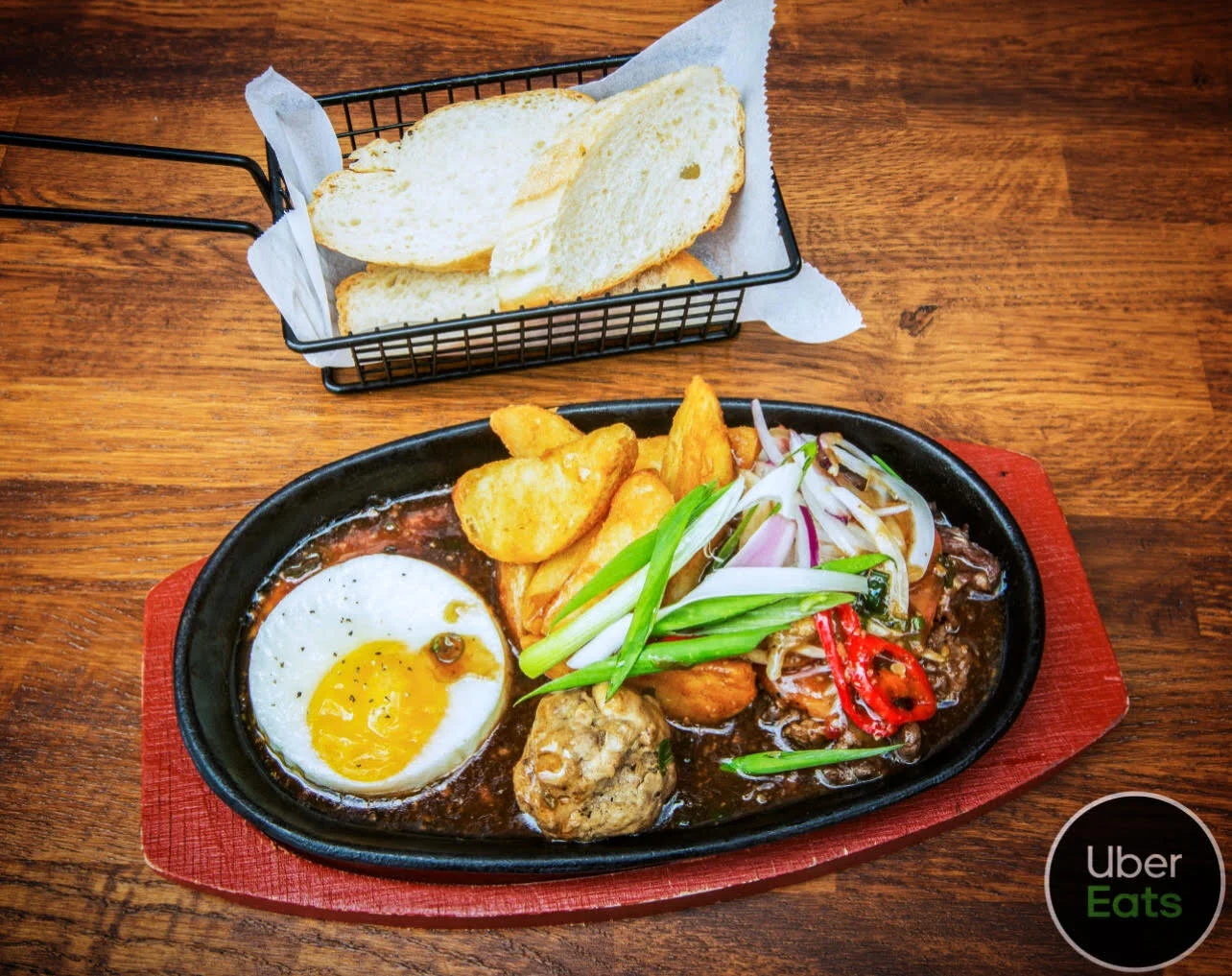 Marinated rib eye beef, beef meat ball, fries and sunrise egg