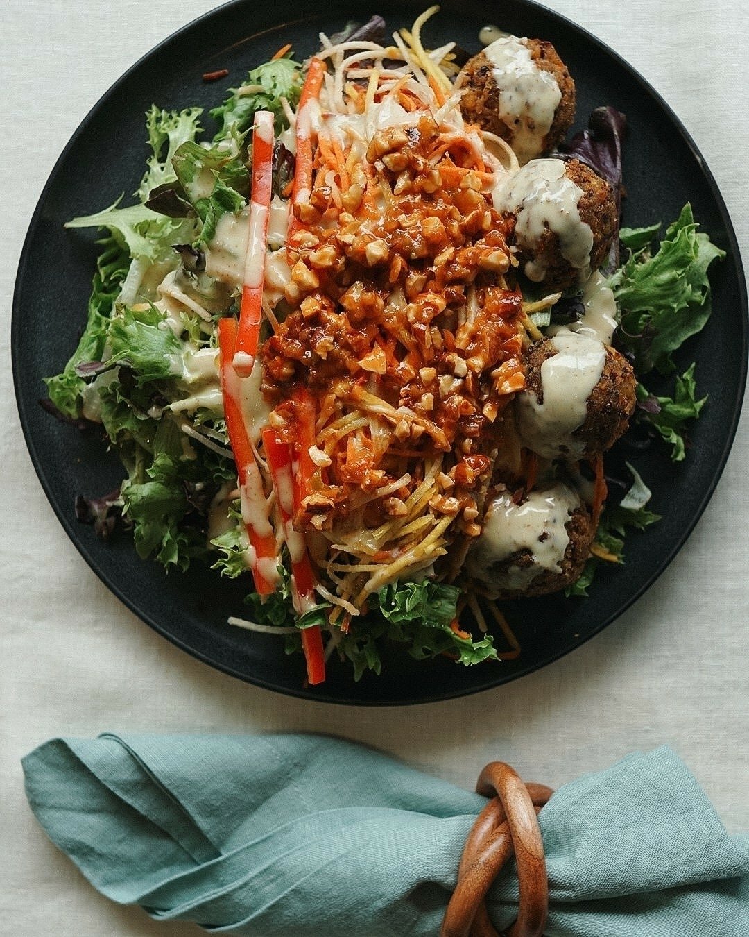 Quinoa done right. 👌

Meet our Quinoa Burger Salad: savory baked quinoa bites made with carrots, garlic, plant-based cheese, scallions, and olive oil, layered over mesclun greens with almond crunch and mustard dressing. 

Rich in fiber &amp; protein