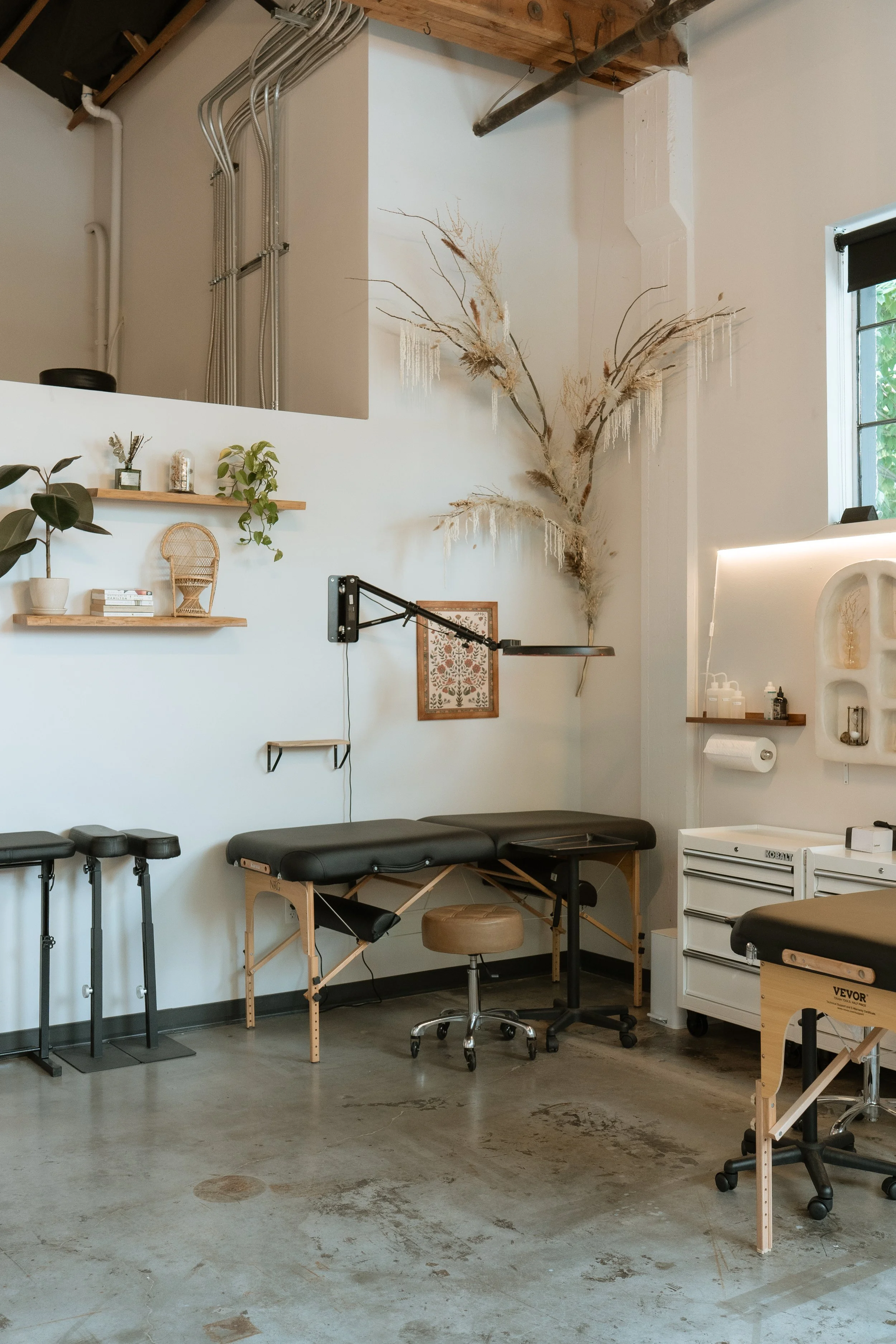 Available corner station equipped with a toolbox, rolling stool, mounted overhead light, and most disposable supplies.