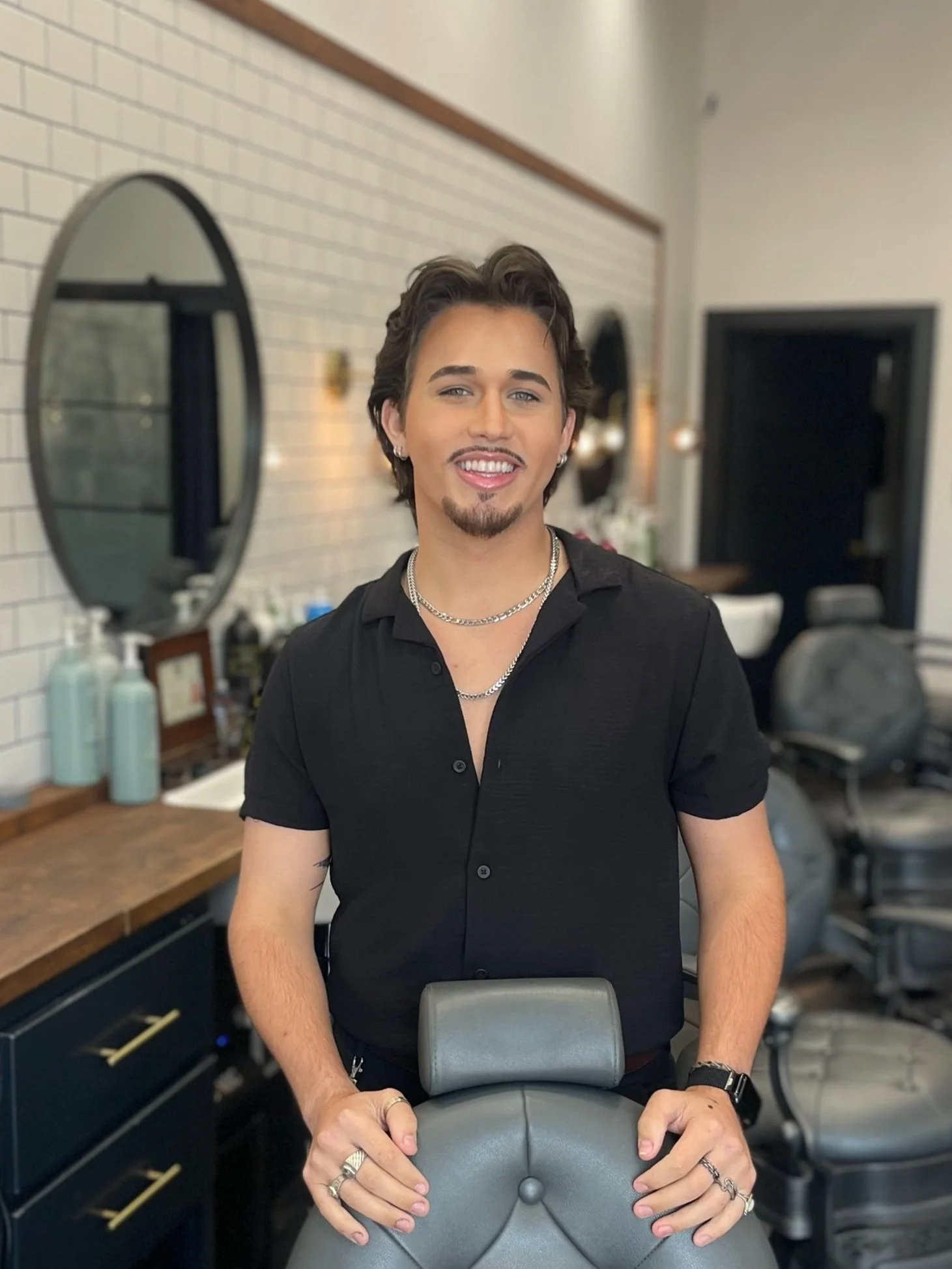 Portrait of Corban, Barber specializing in classic and modern men's cuts at Headquarters.