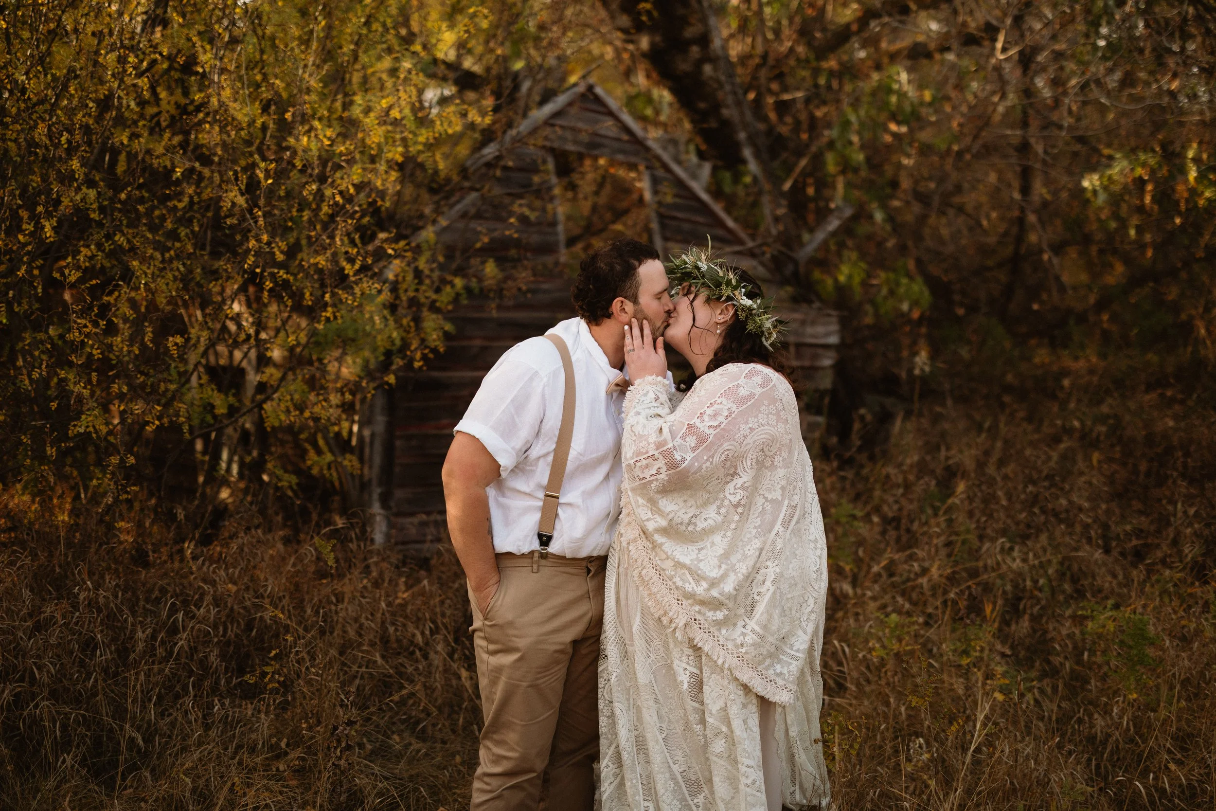 bride and groom share a kiss in late fall 
