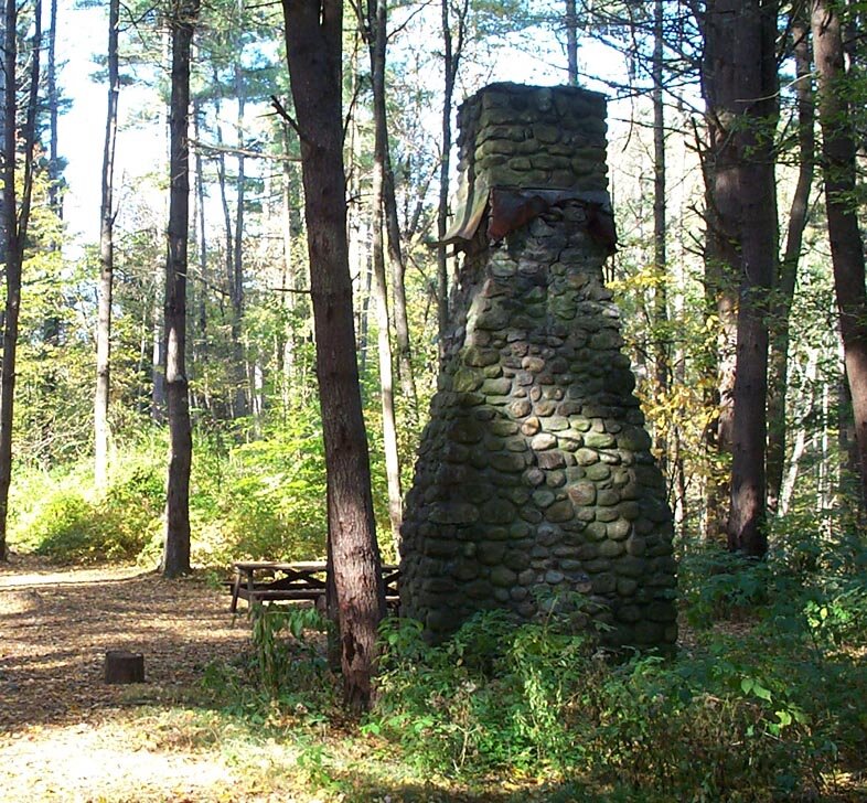 This stone chimney and a few other ruins among the trees are about all that is left of Camp White. Camp White was a Civilian Conservation Corps camp located in Barkhamsted between Pleasant Valley and Riverton in what is now American Legion State For