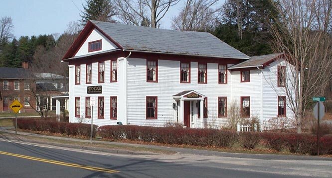 Arba Alford completed this house in 1833. Alford was a partner with Lambert Hitchcock in the chair business located across the street from the house. Hitchcock occupied one side of the house, which actually was a duplex- one side was the mirror ima