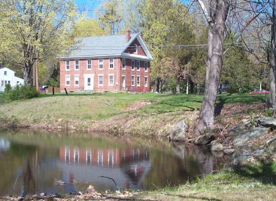 Located in Pleasant Valley near the bridge over the Farmington River, this brick building was built about 1840 and served as a hotel for many of its early years. Not one of the oldest houses in town, but don't you think it has a certain stately aspe