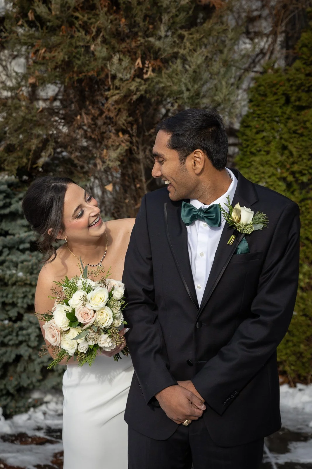 Newlyweds on The Atrium rooftop in Shorewood Wisconsin photographed by Milwaukee wedding photographer. Winter Wedding.