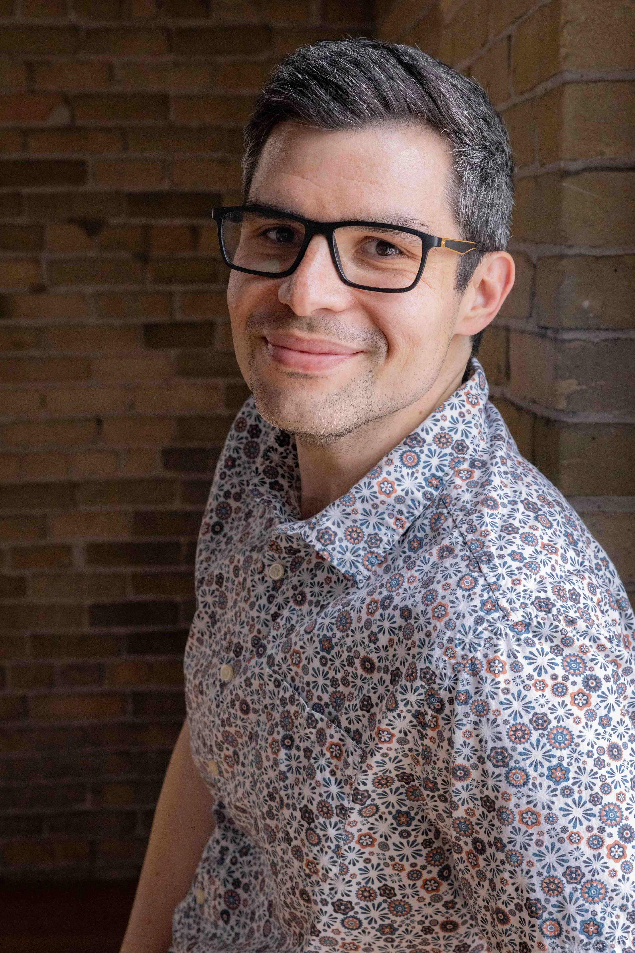 A business man has his portrait taken with Lindsay Stayton Photography at her Milwaukee Studio