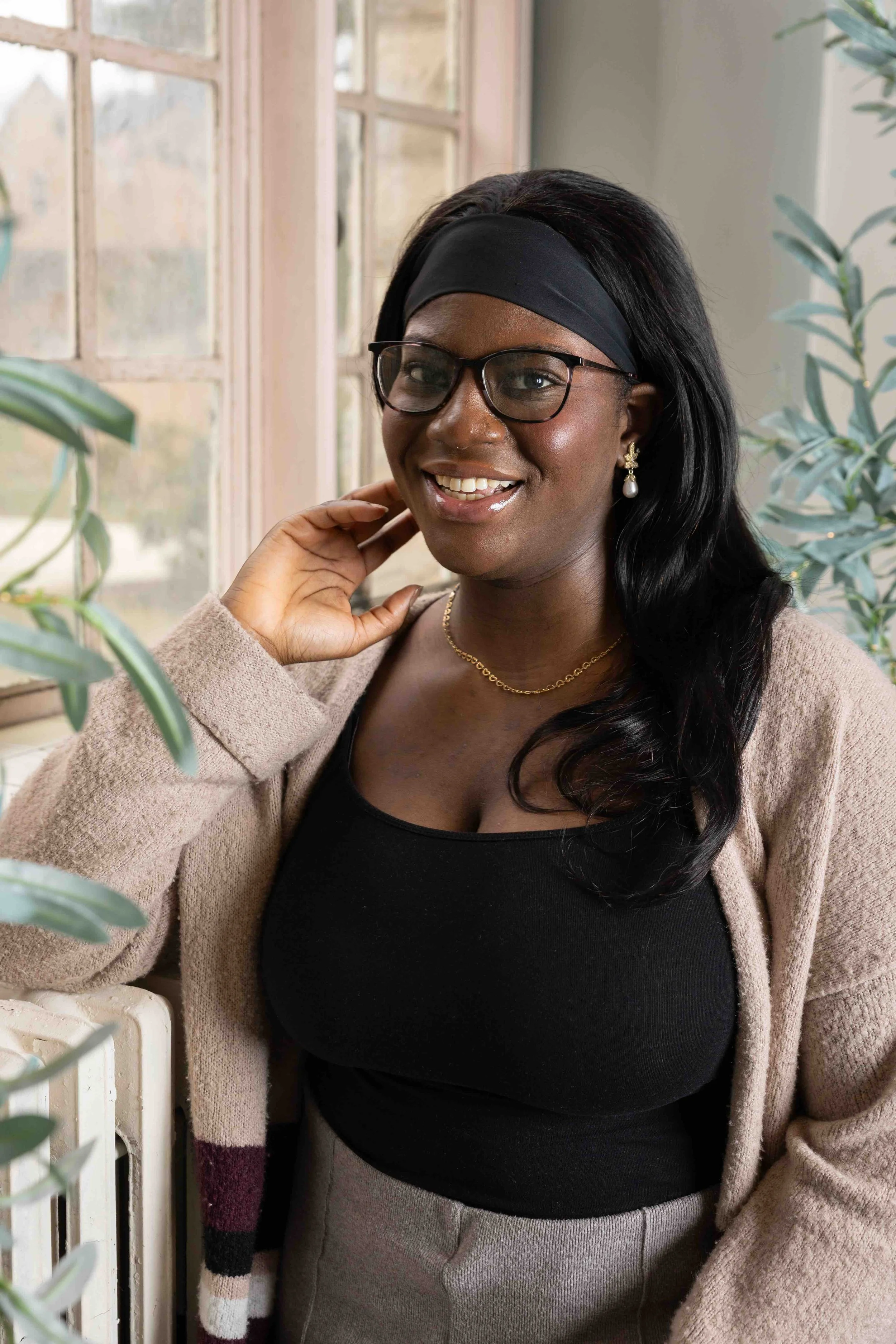 A young business woman smiles for her portrait