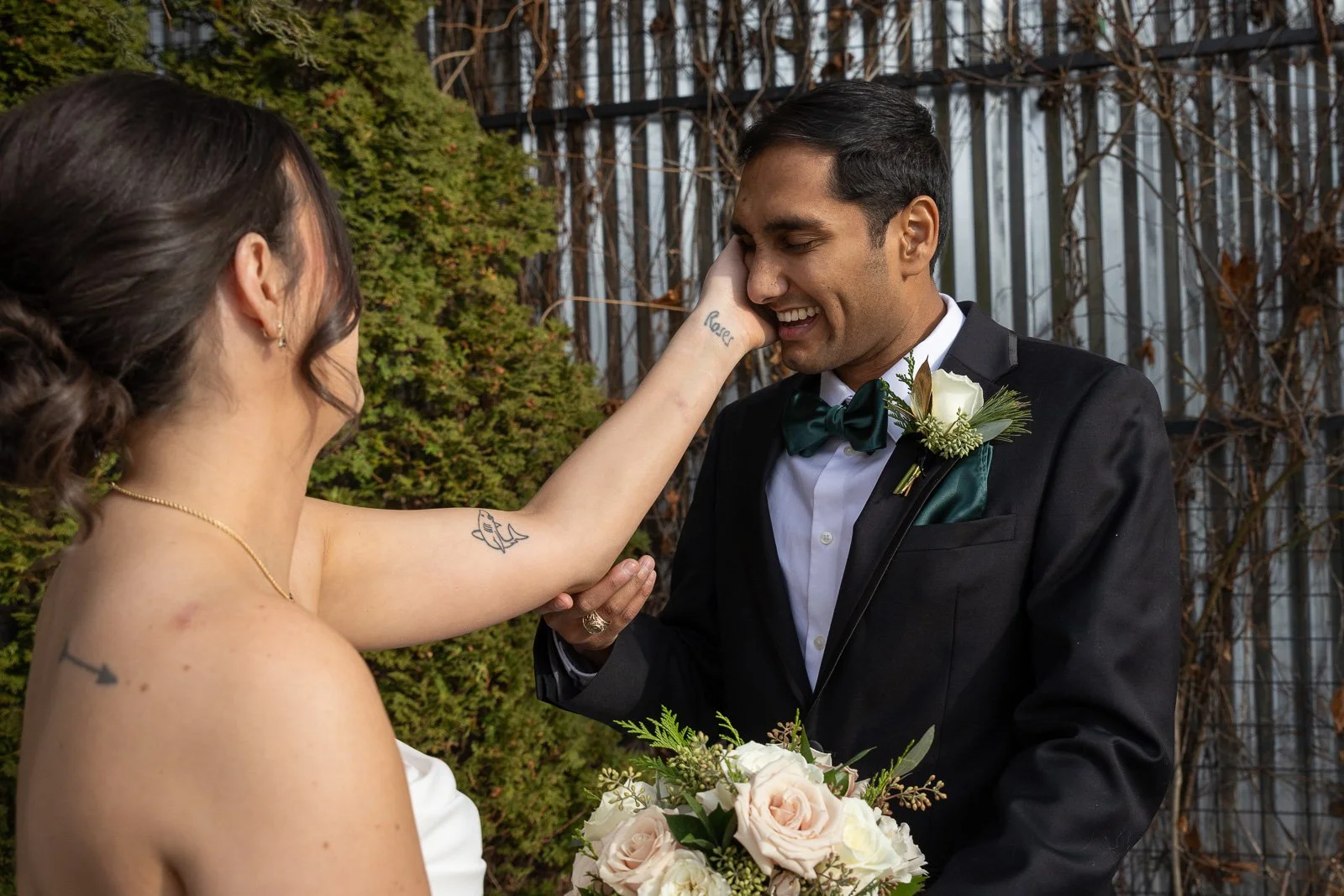 Newlyweds on The Atrium rooftop in Shorewood Wisconsin photographed by Milwaukee wedding photographer. Winter Wedding.