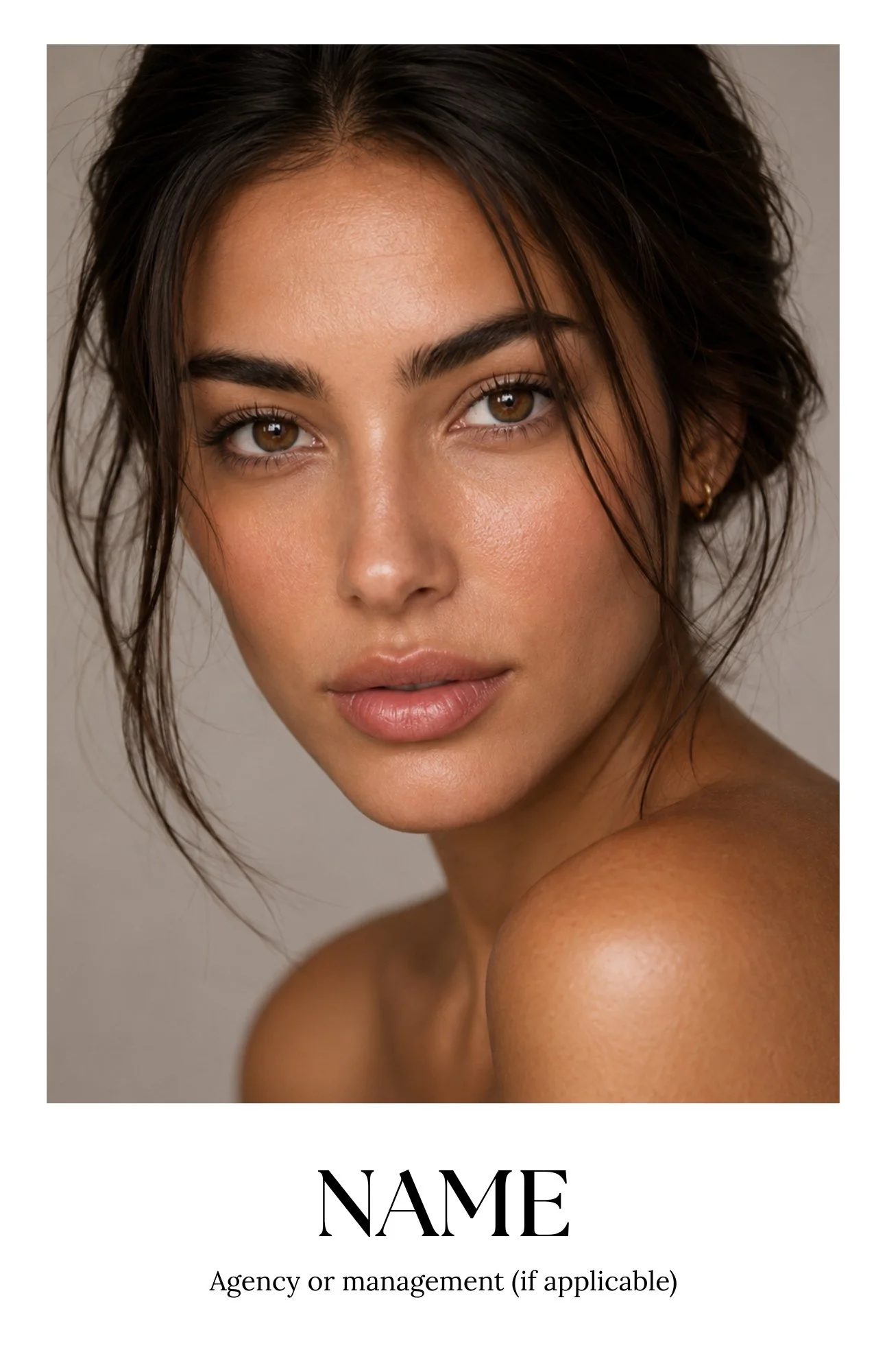 Close-up portrait of a young woman with brown eyes, dark brown hair styled in layers, and natural makeup, looking directly at the camera.