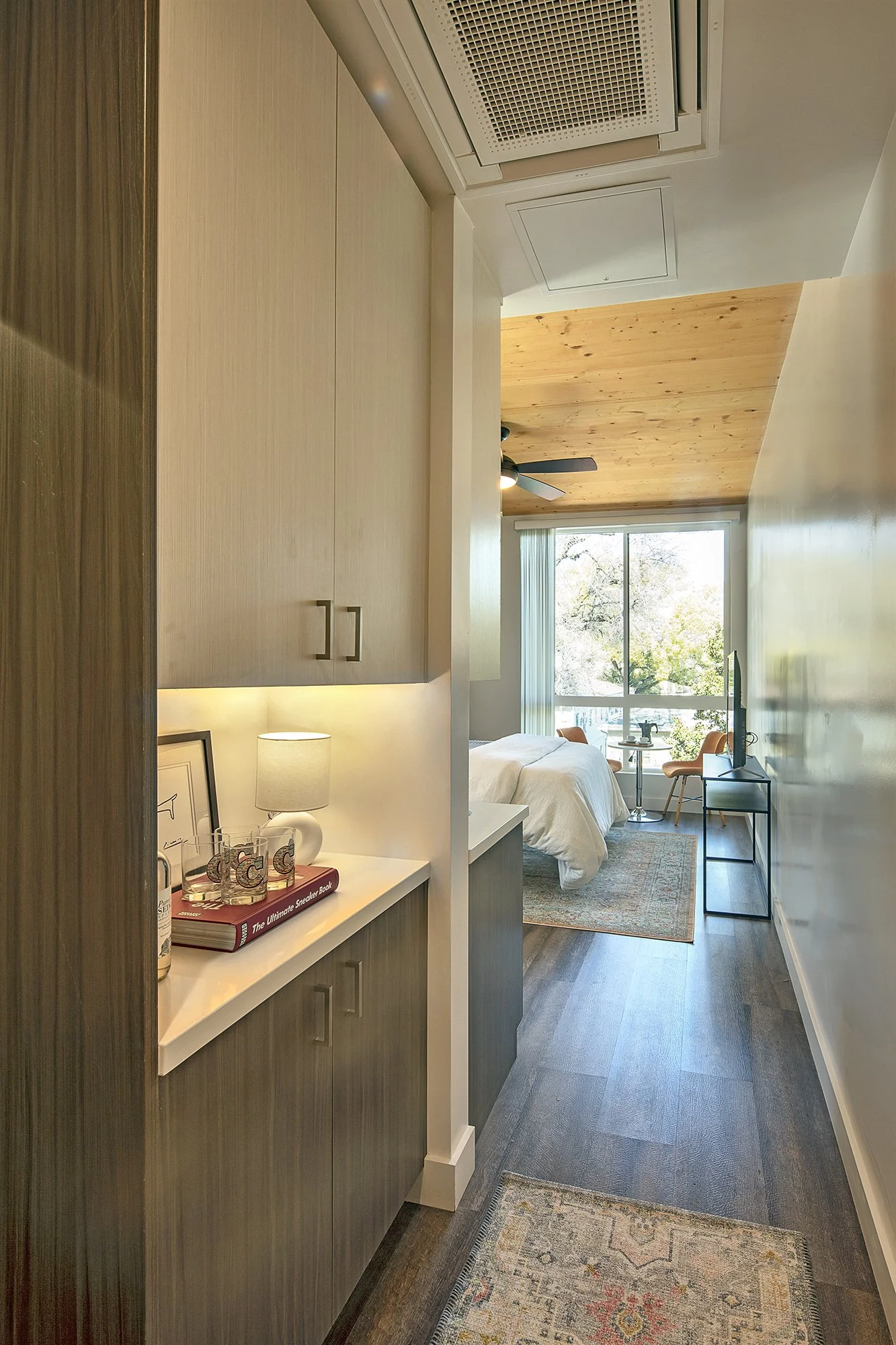 Hallway entrance into studio apartment unit.