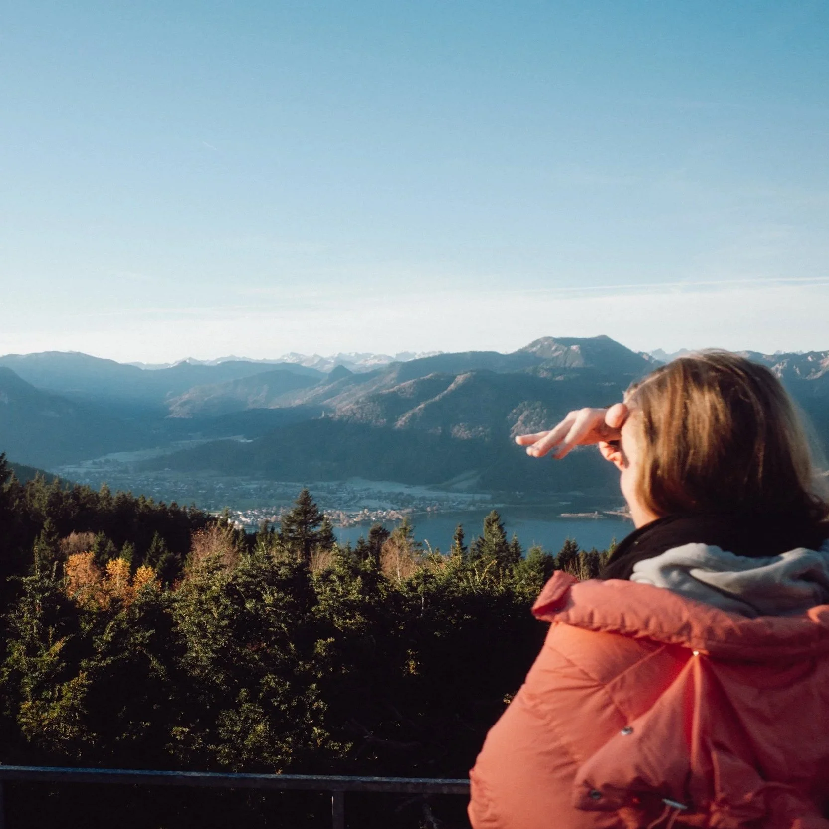 MKM Team member looking over the Tegernsee after an afterwork hike at the top of the mountain. 