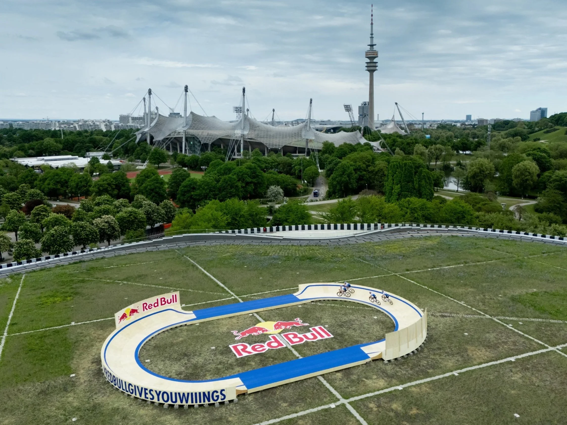 Aerial view of a Red Bull race track built on the SAP Garden in Munich Olympiapark with the Olympiaturm in the background