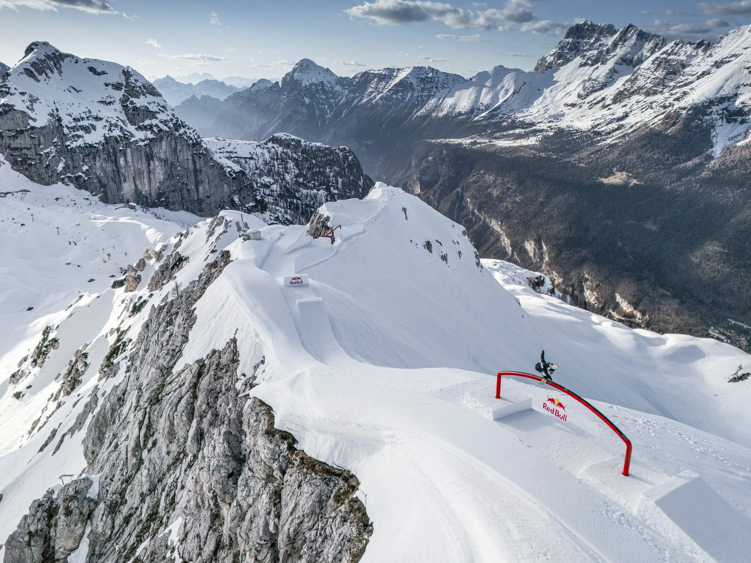 Snow park feature with a Red Bull kicker built on an alpine summit ridge for the Slope Style on the Edge project together with Red Bull Germany.