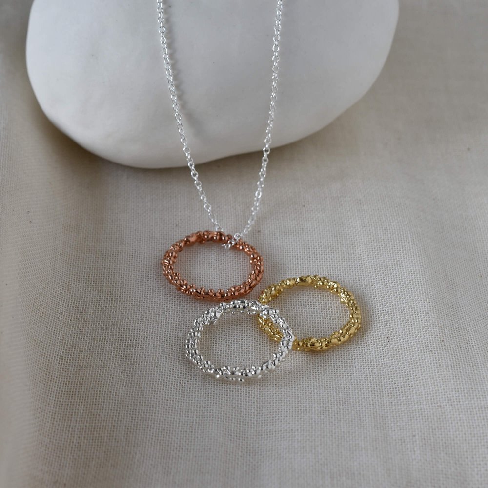 3 circle pendants in different metals: rose and yellow gold plus sterling Silver