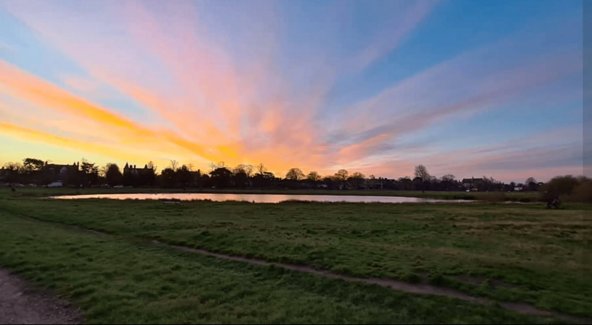 Sunset behind the pond of Wimbledon Common