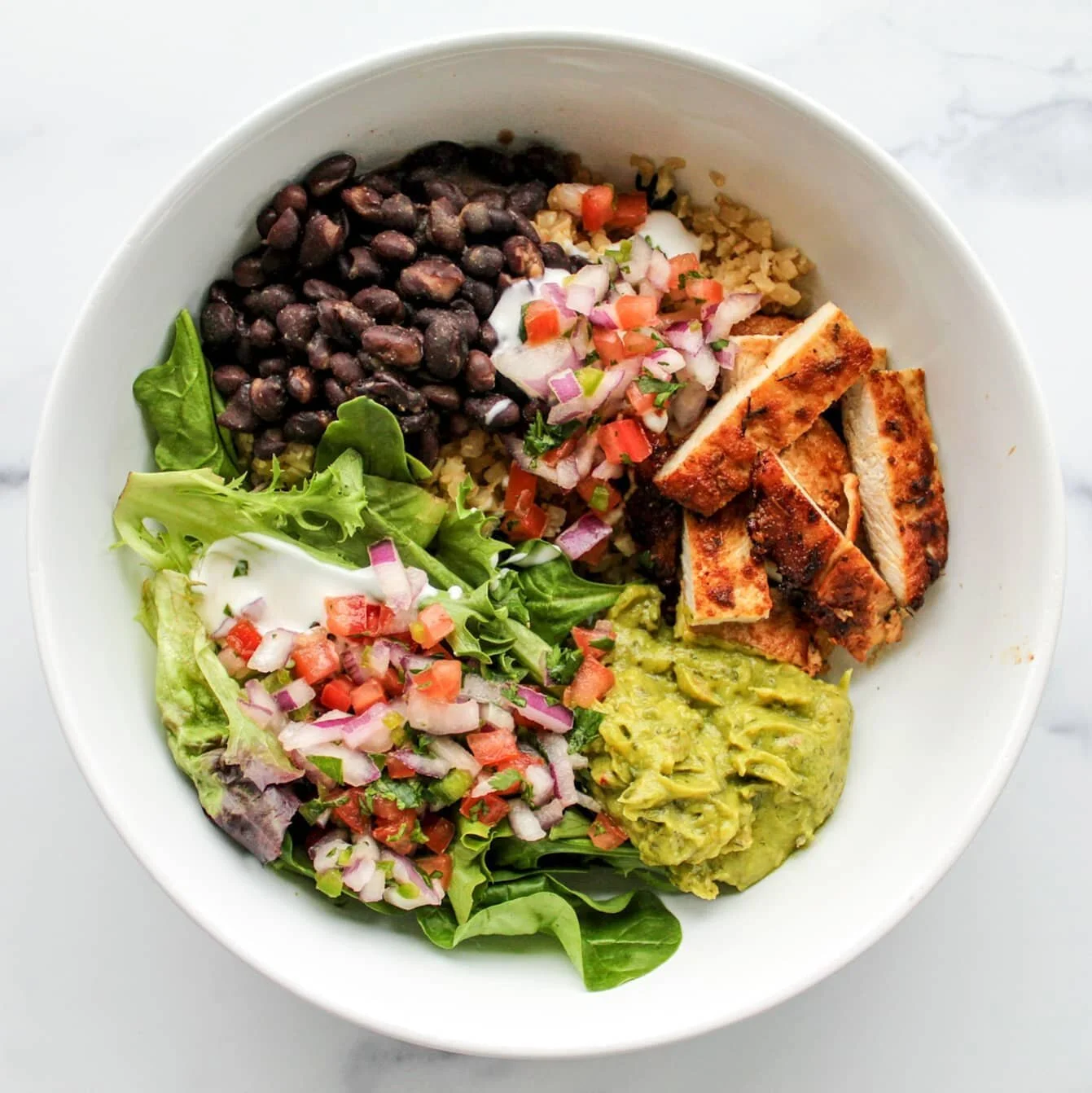 Tonight's Cinco de Mayo dinner is a homemade paleo-ish burrito bowl with cauliflower rice, black beans, chicken and greens, served with guacamole, pico de gallo and cashewmilk sour cream.
.
#natieats #westchesterblogger #westchesterfoodie #feedfeed #