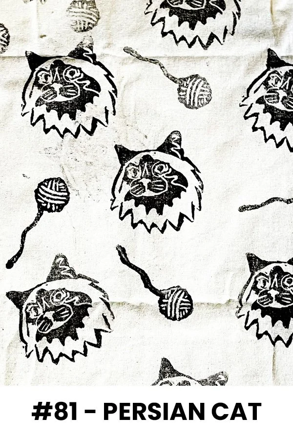 Black and white pattern featuring Persian cats with pointed ears and facial markings, alongside balls of yarn with tangled strings.