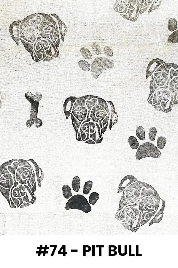 Pattern with multiple dog faces and paw prints, labeled '#74 - Pit Bull'.