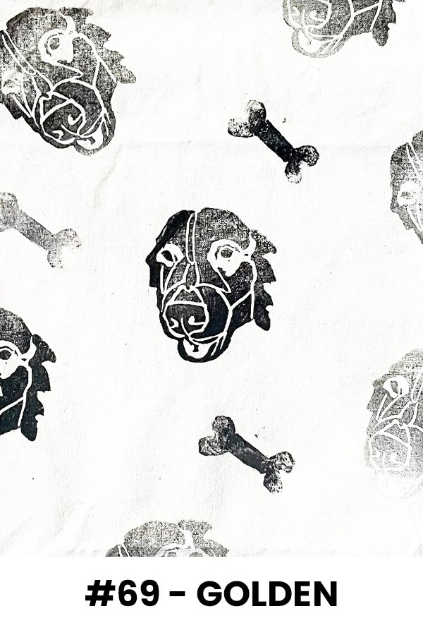 Pattern featuring black and white stylized dog faces and bones on a light background, labeled '#69 - GOLDEN'.
