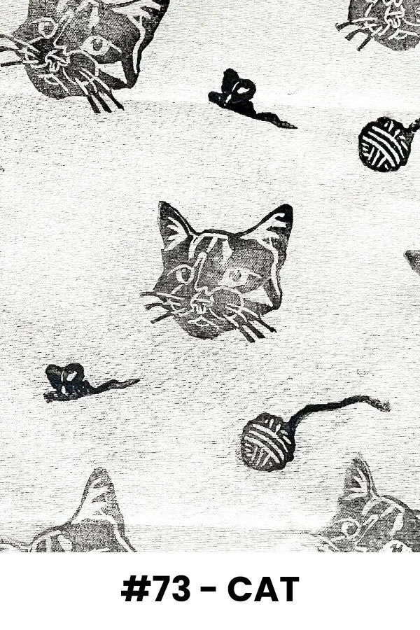 Pattern with cat faces, balls of yarn, and mice in black and white.
