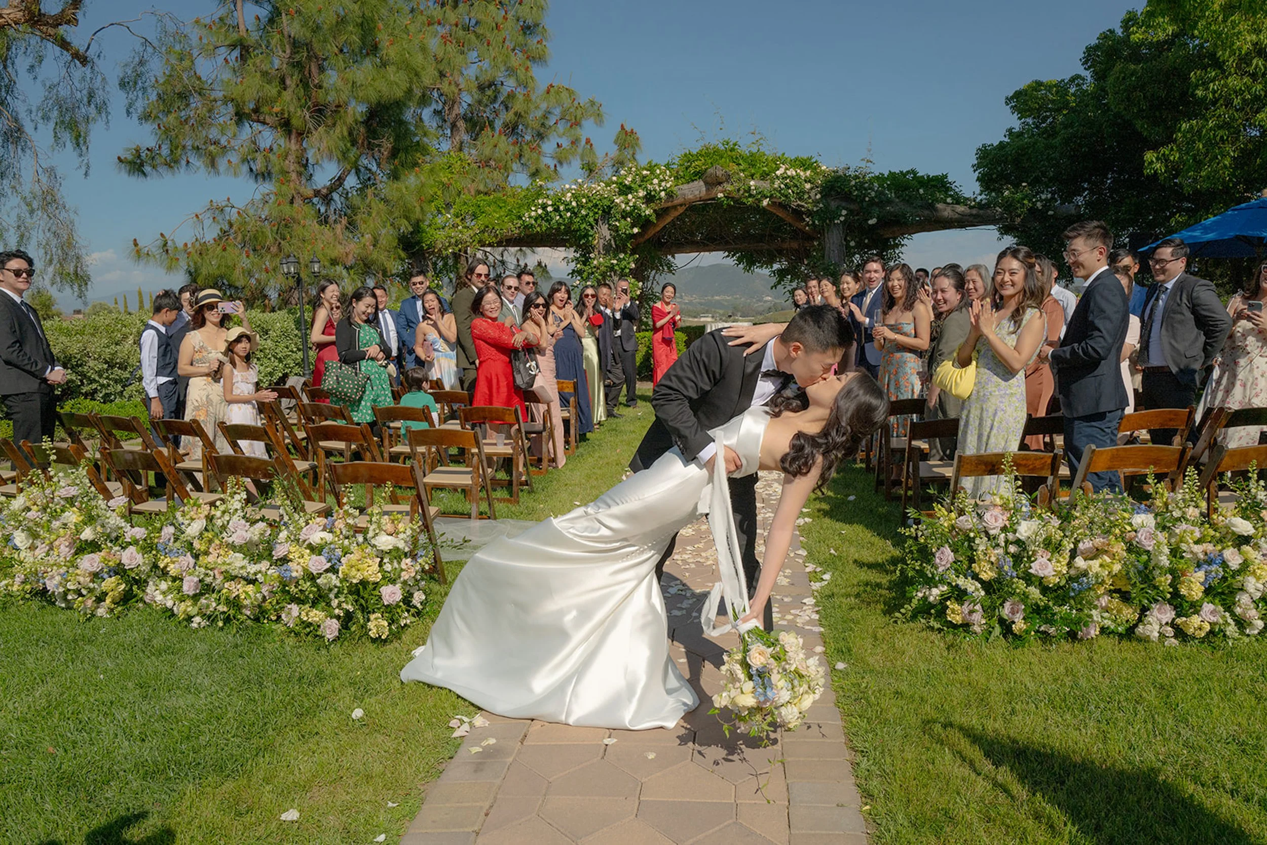 Temecula vineyard wedding ceremony setup South Coast Winery wedding reception design vineyard wedding lighting and tablescape elegant wine country wedding design California outdoor vineyard wedding guest experience