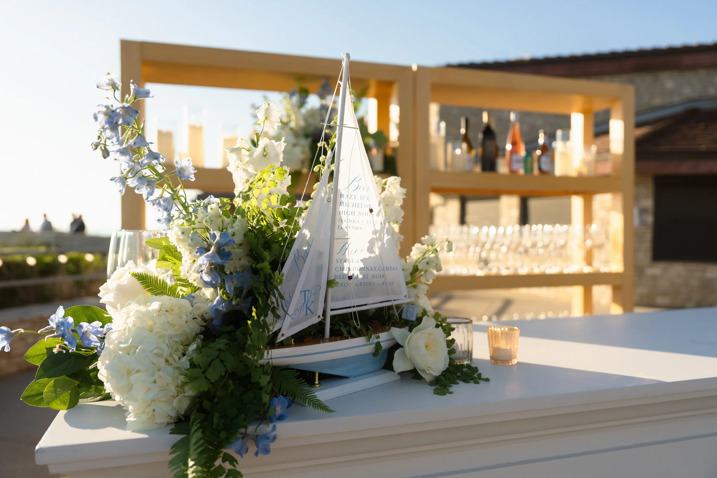 Blue and white floral welcome display at a Point Vicente wedding welcome party overlooking the Palos Verdes coast.