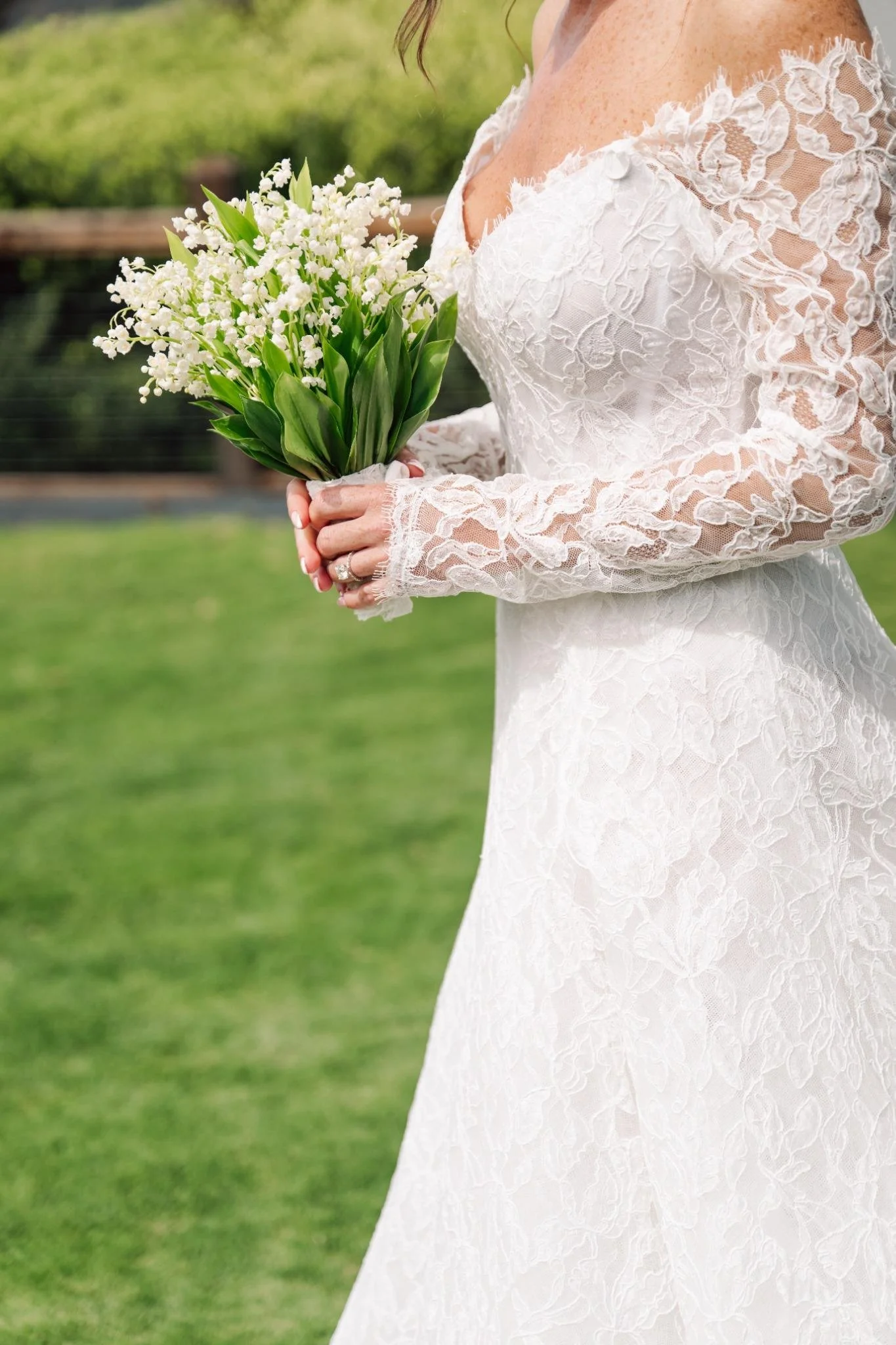 Close-up of bride holding white floral bouquet at a private estate wedding in Rolling Hills Estates, California