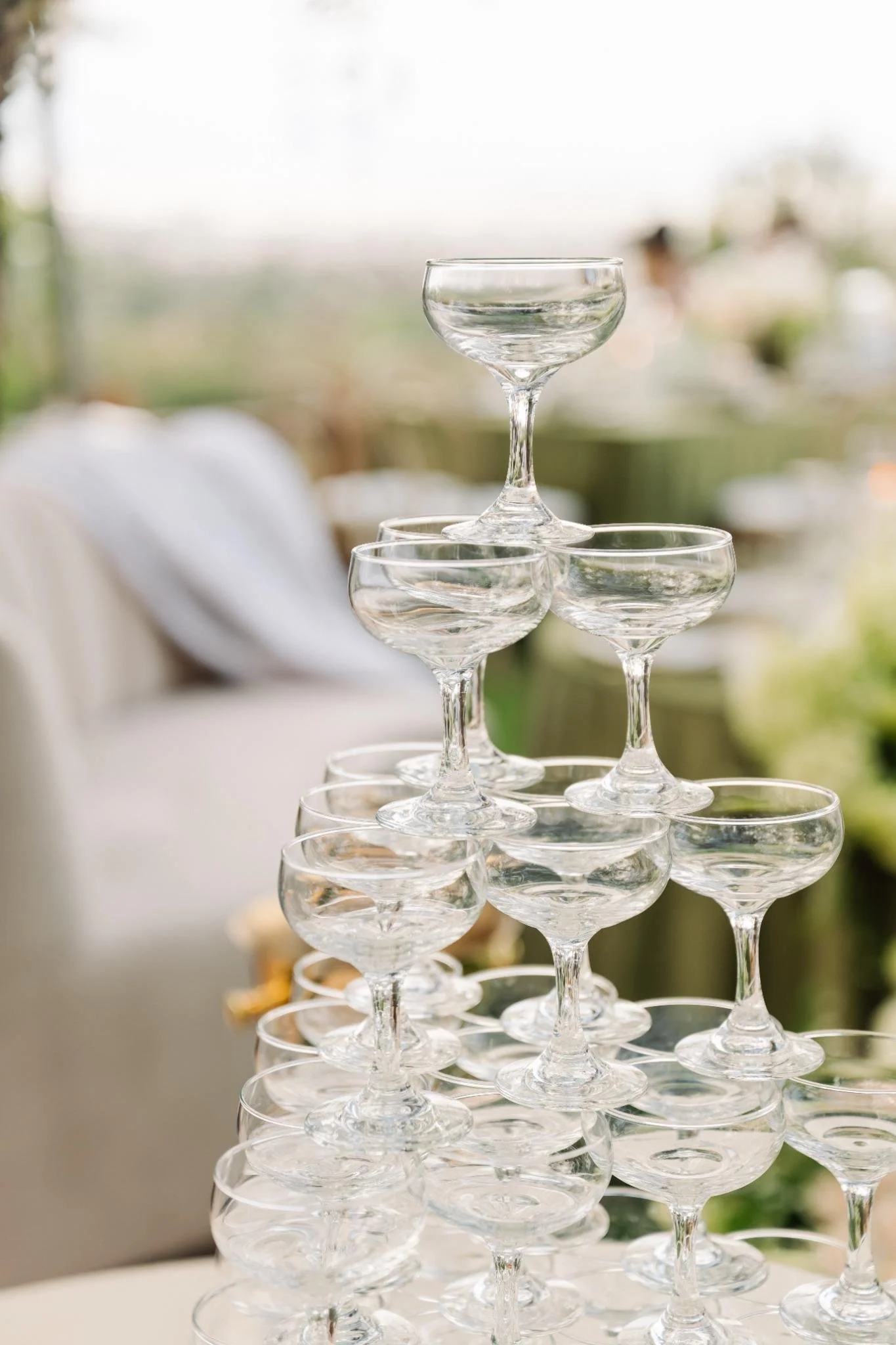 Champagne tower display at private estate wedding in Rolling Hills Estates with elegant glassware detail