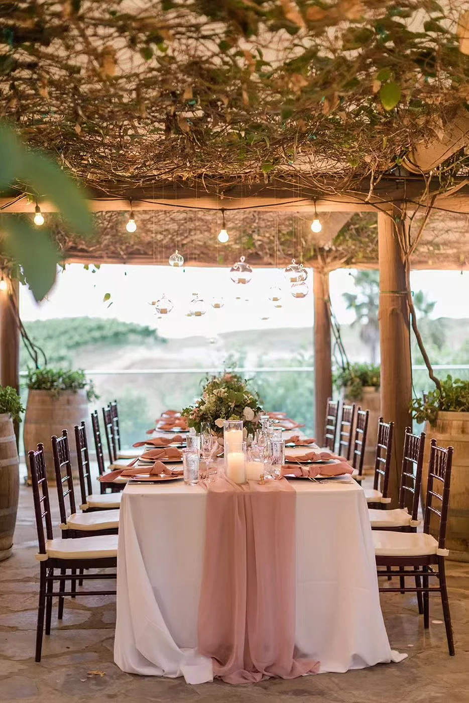 Outdoor wedding reception dinner setup under pergola at Callaway Winery Temecula