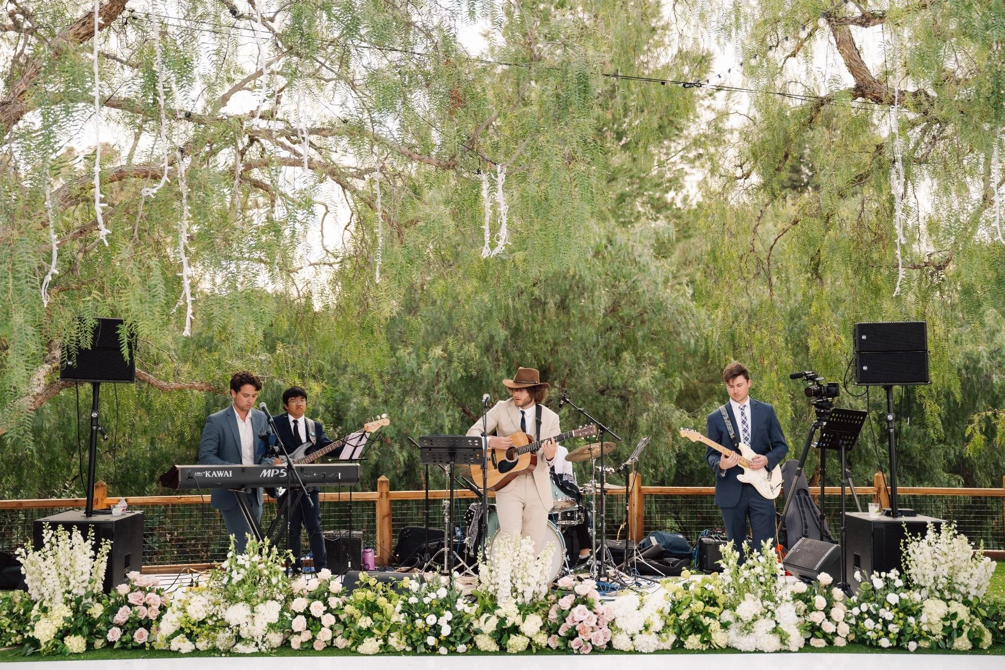 Live band performing at outdoor private estate wedding reception in Rolling Hills Estates, California
