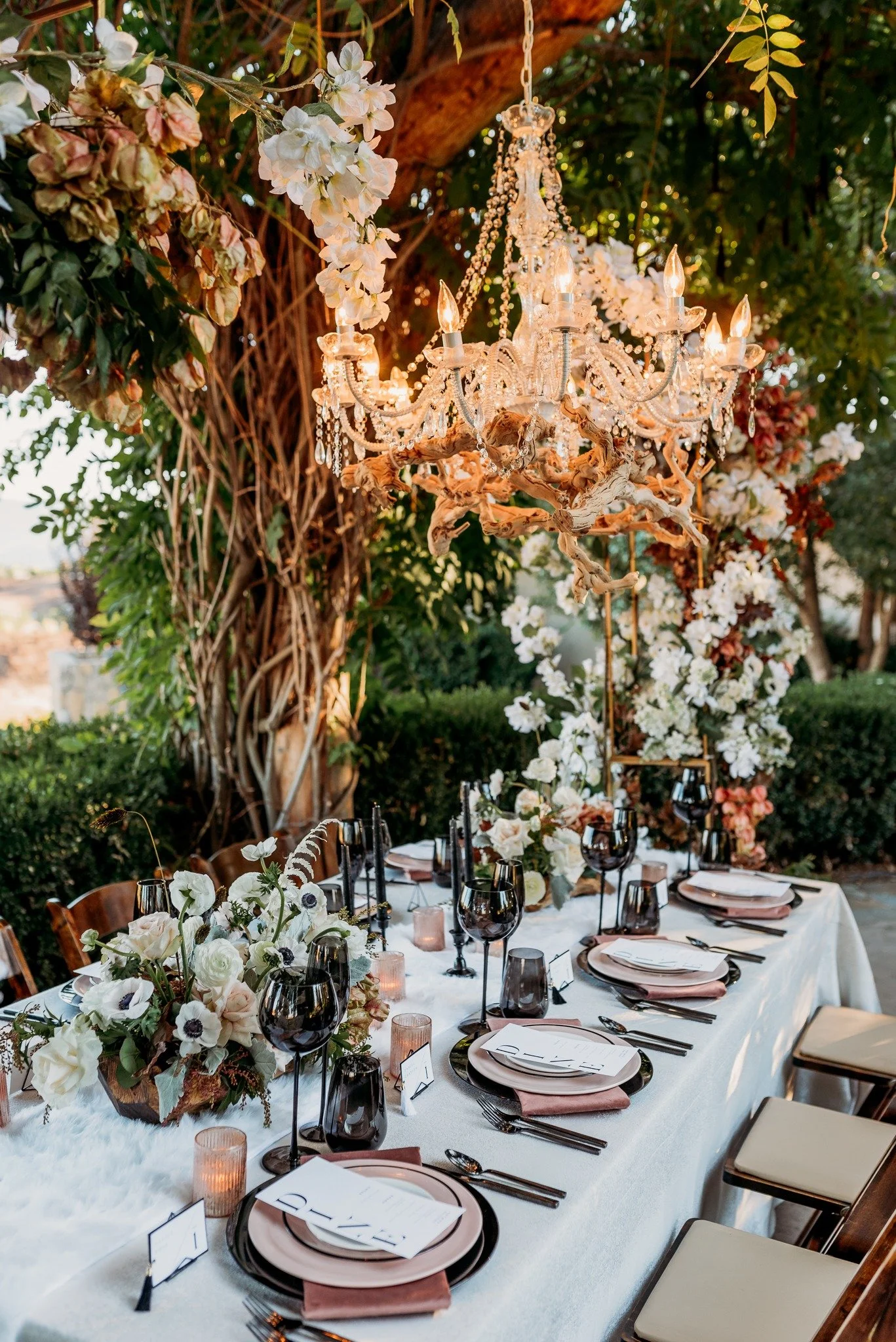 Reception tablescape with cascading florals and layered textures at South Coast Winery fall vineyard wedding editorial
