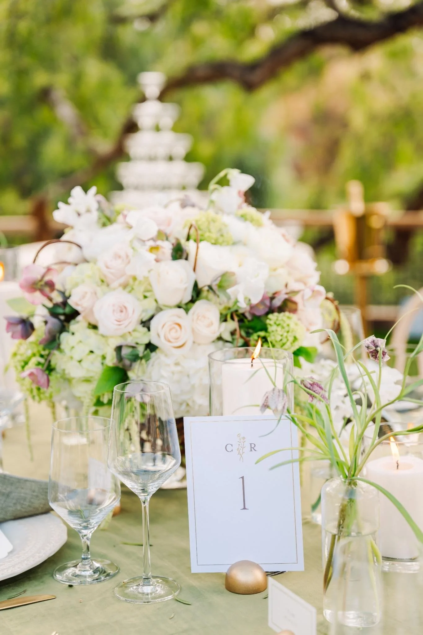 Reception tablescape with green linens and floral centerpieces at private estate wedding in Rolling Hills Estates