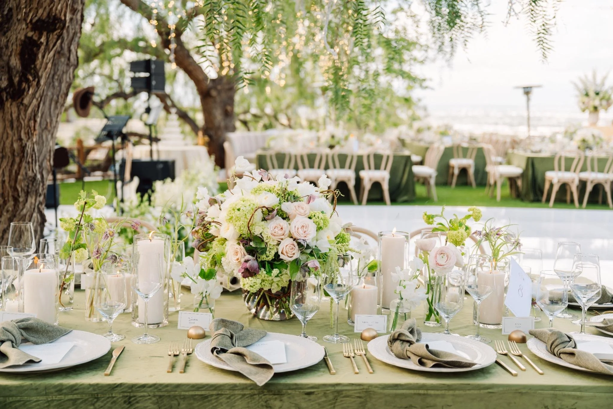 Reception tablescape with green linens and floral centerpieces at private estate wedding in Rolling Hills Estates
