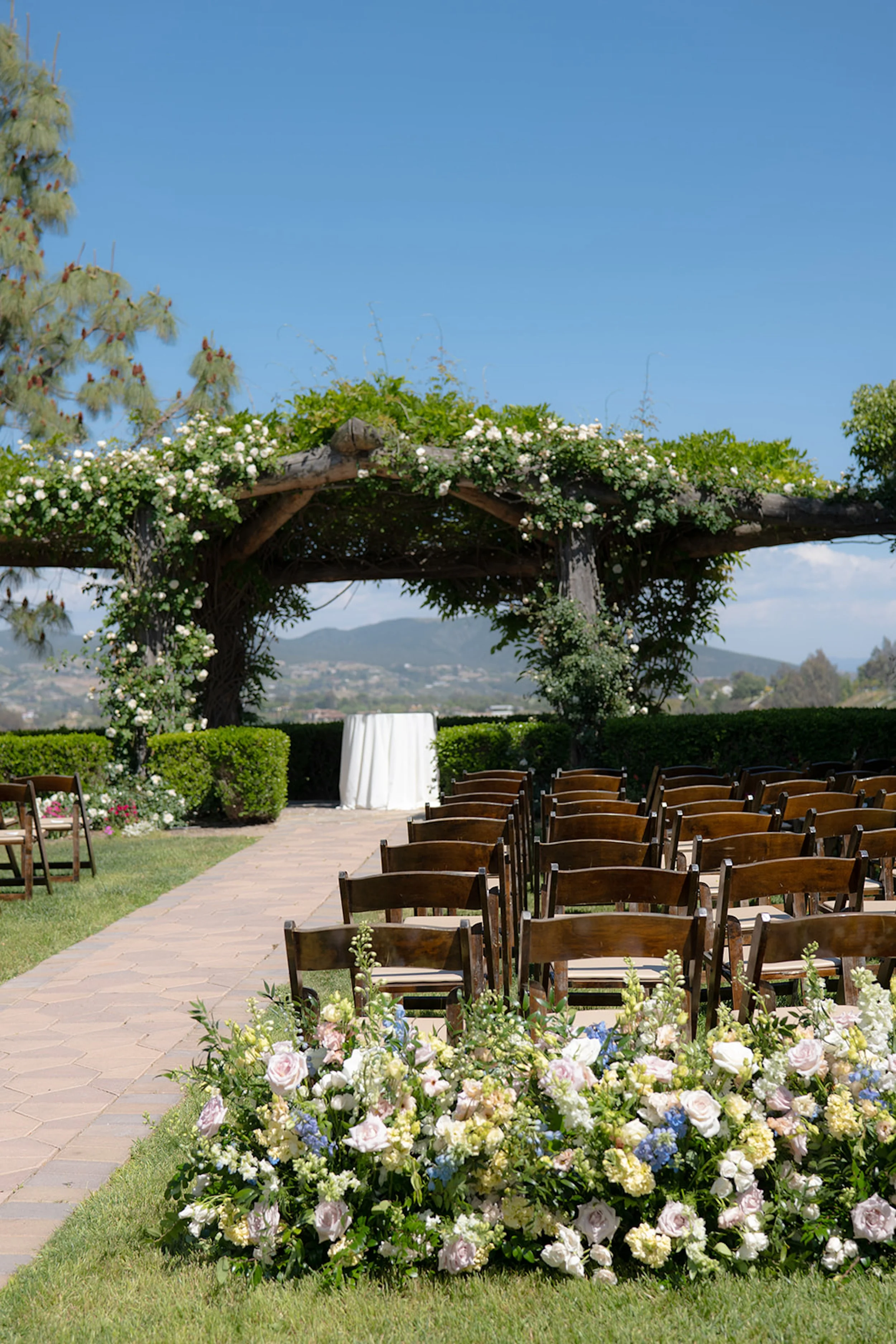 Temecula vineyard wedding ceremony setup South Coast Winery wedding reception design vineyard wedding lighting and tablescape elegant wine country wedding design California outdoor vineyard wedding guest experience