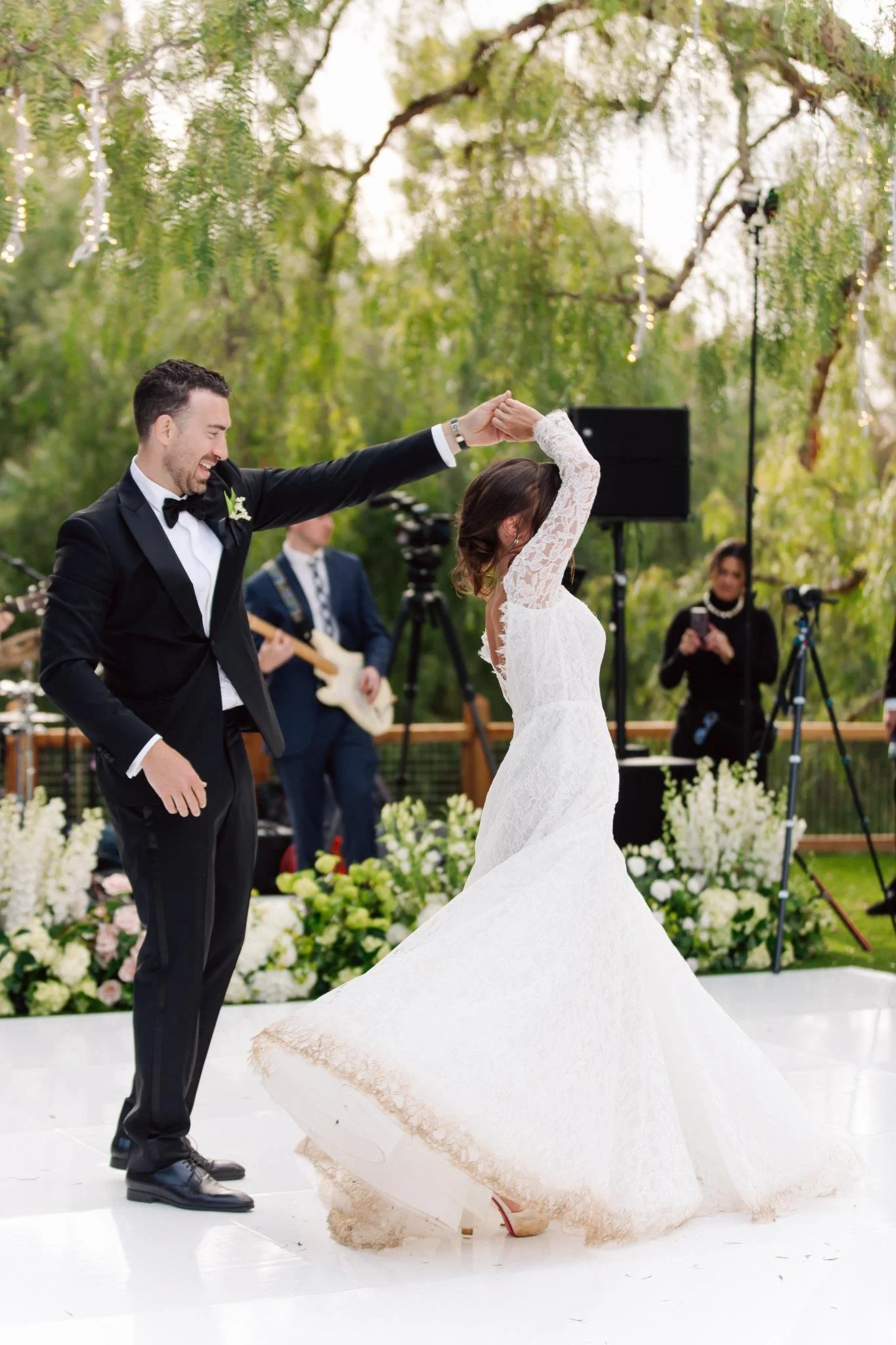 Bride and groom first dance at outdoor private estate wedding in Rolling Hills Estates with live music