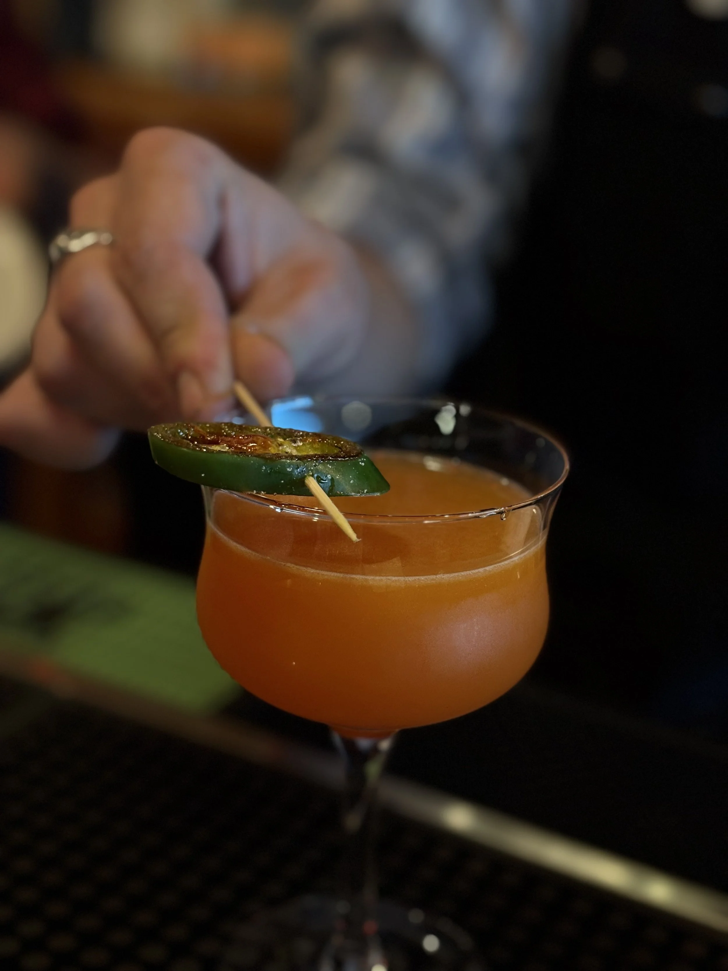 specialty craft cocktail with jalapenos